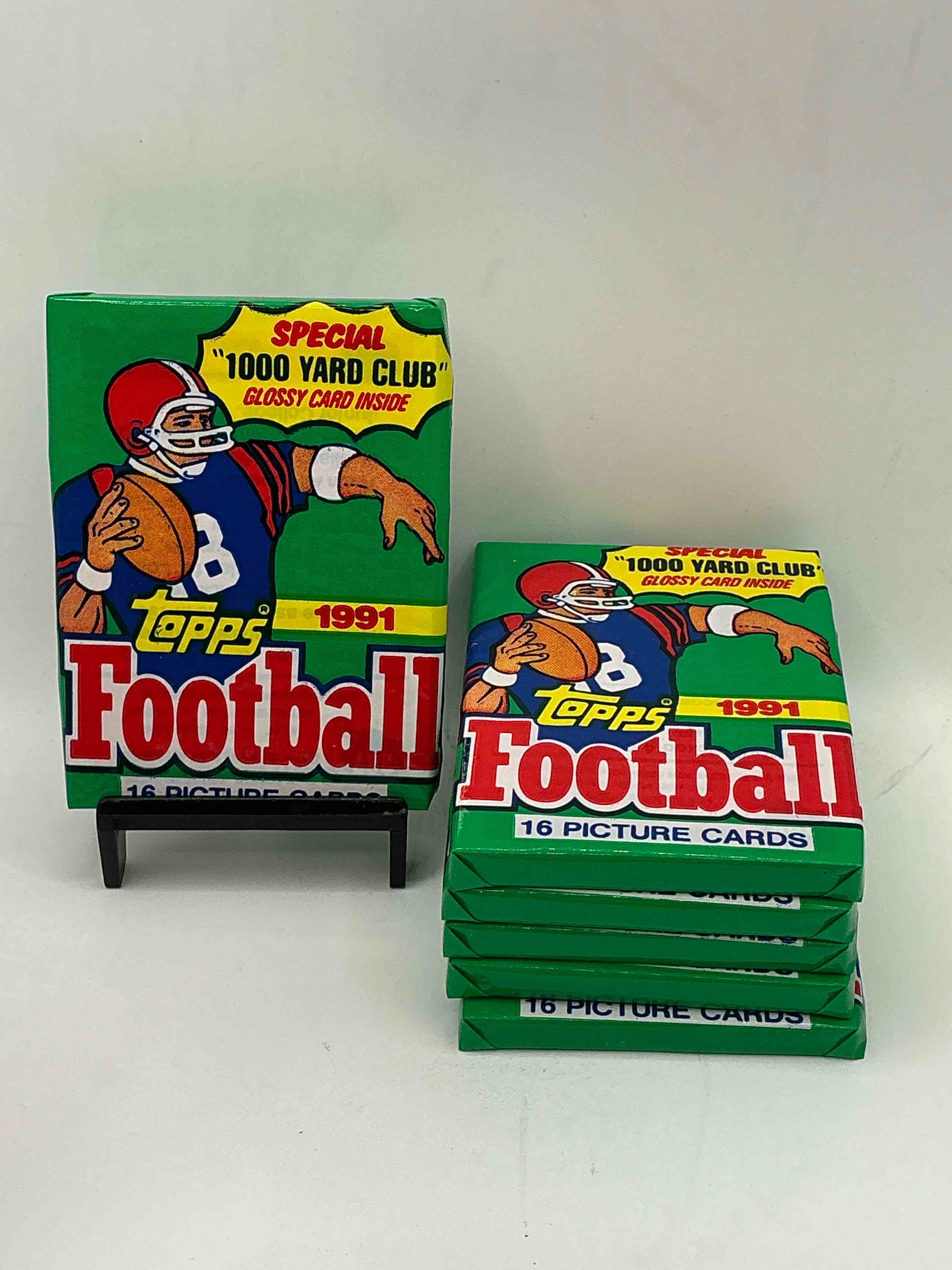 1991 topps football unopened sports card wax pack, direct from original retail case. search for early barry sanders, emmitt smith, jerry rice & joe montana!