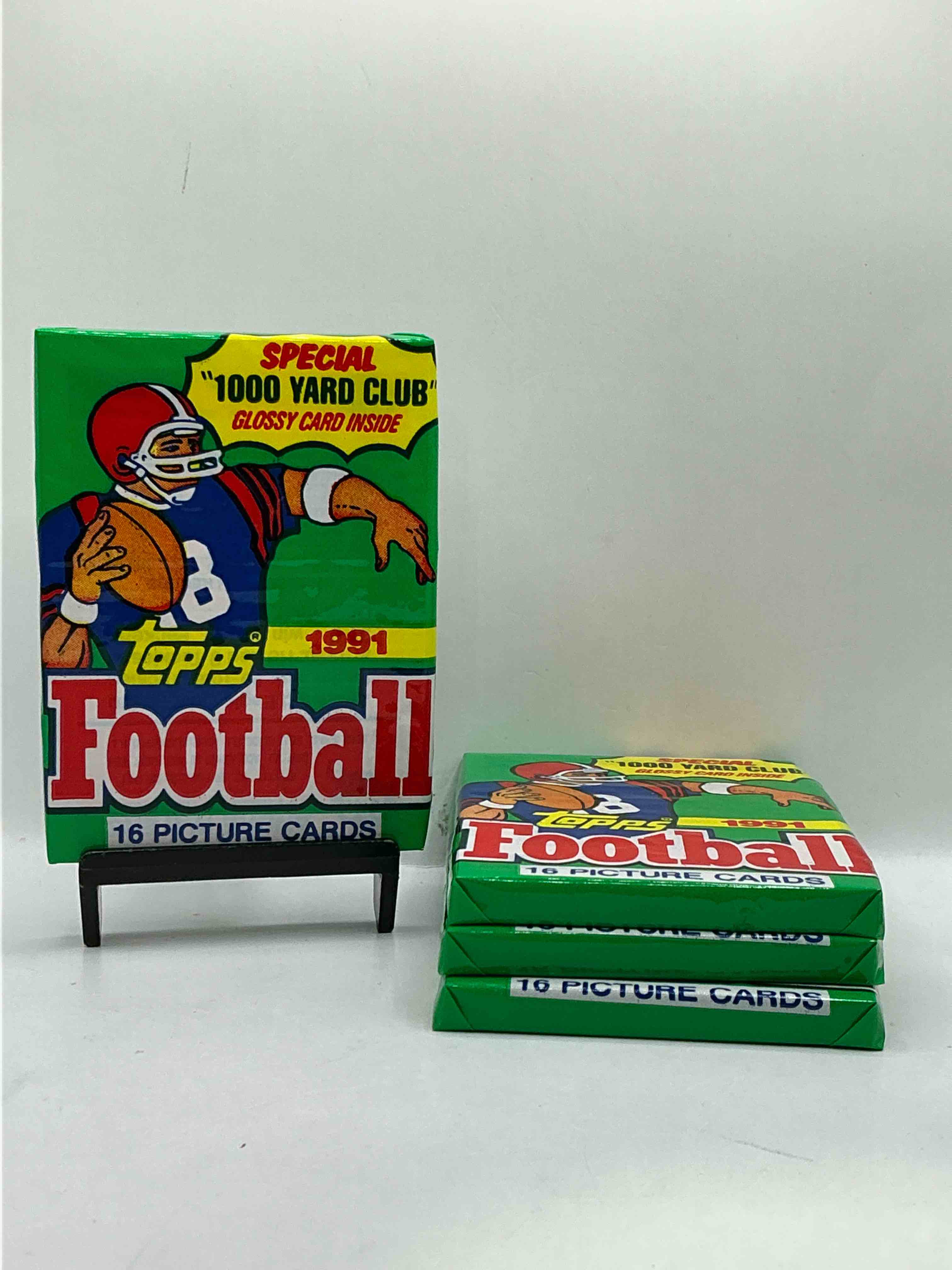 1991 topps football unopened sports card wax pack, direct from original retail case. search for early barry sanders, emmitt smith, jerry rice & joe montana!