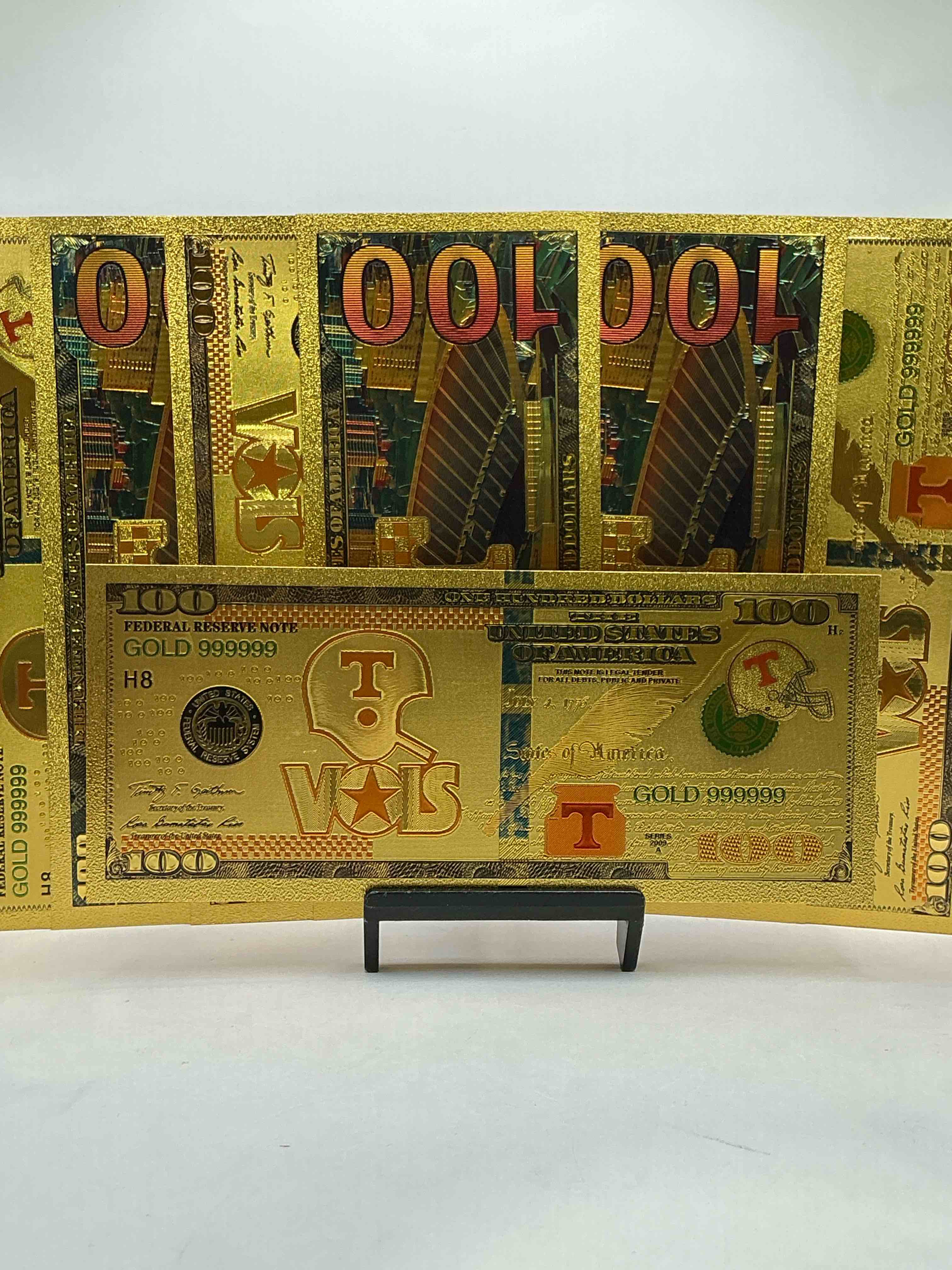 tennessee volunteers collectible memorabilia! super cool, gold in color 100 dollar commemorative ohio state university bill! cool designs on front & back of bill! ut fans rejoice, cool memorabilia! plastic bills with cool designs! 