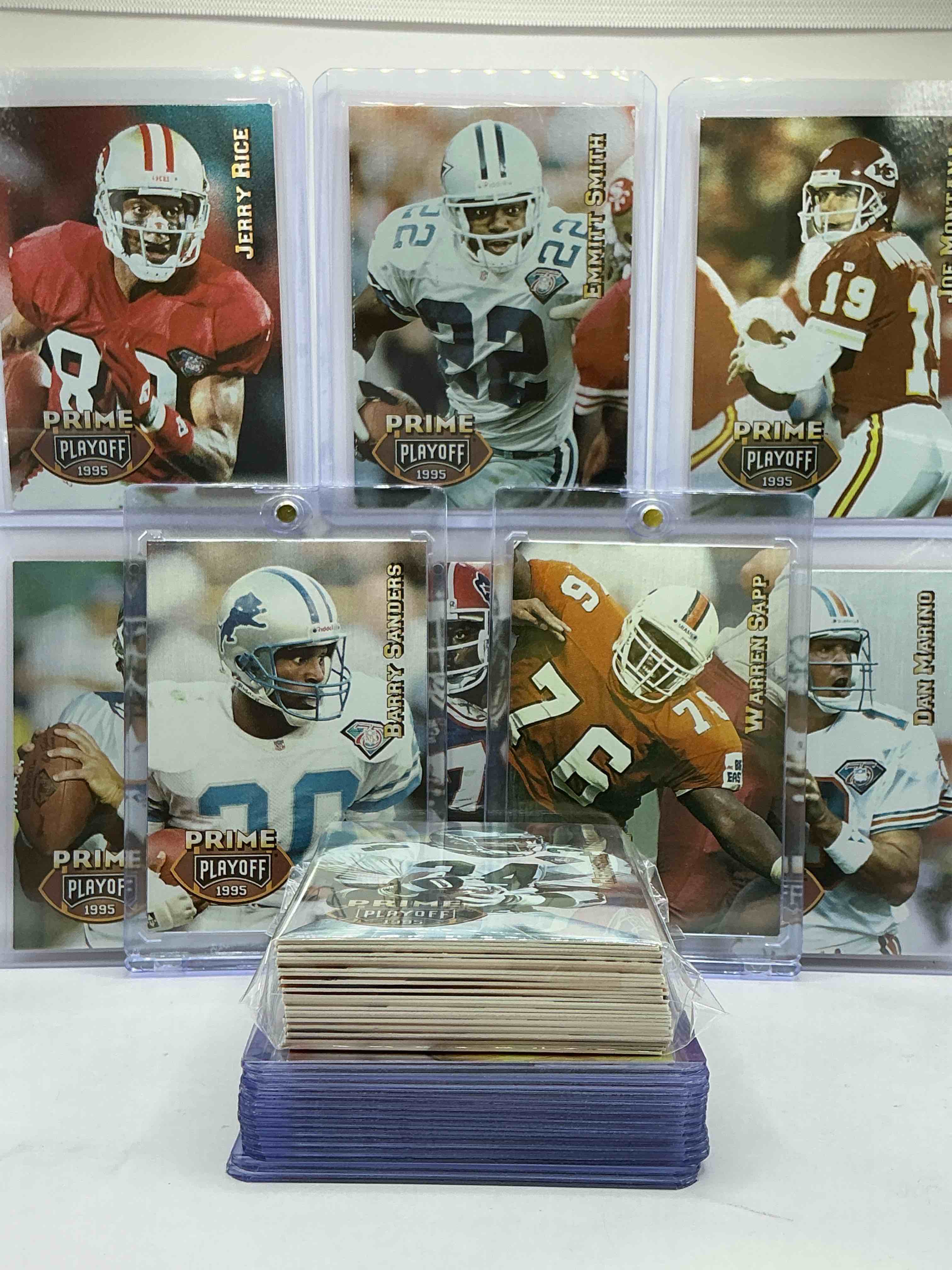 Condition photo showing New/Like New for 1995 playoff football cards! emmitt smith, barry sanders, jerry rice, joe montana, dan marino & more! 50 card playoff football card lot, wow! legends!