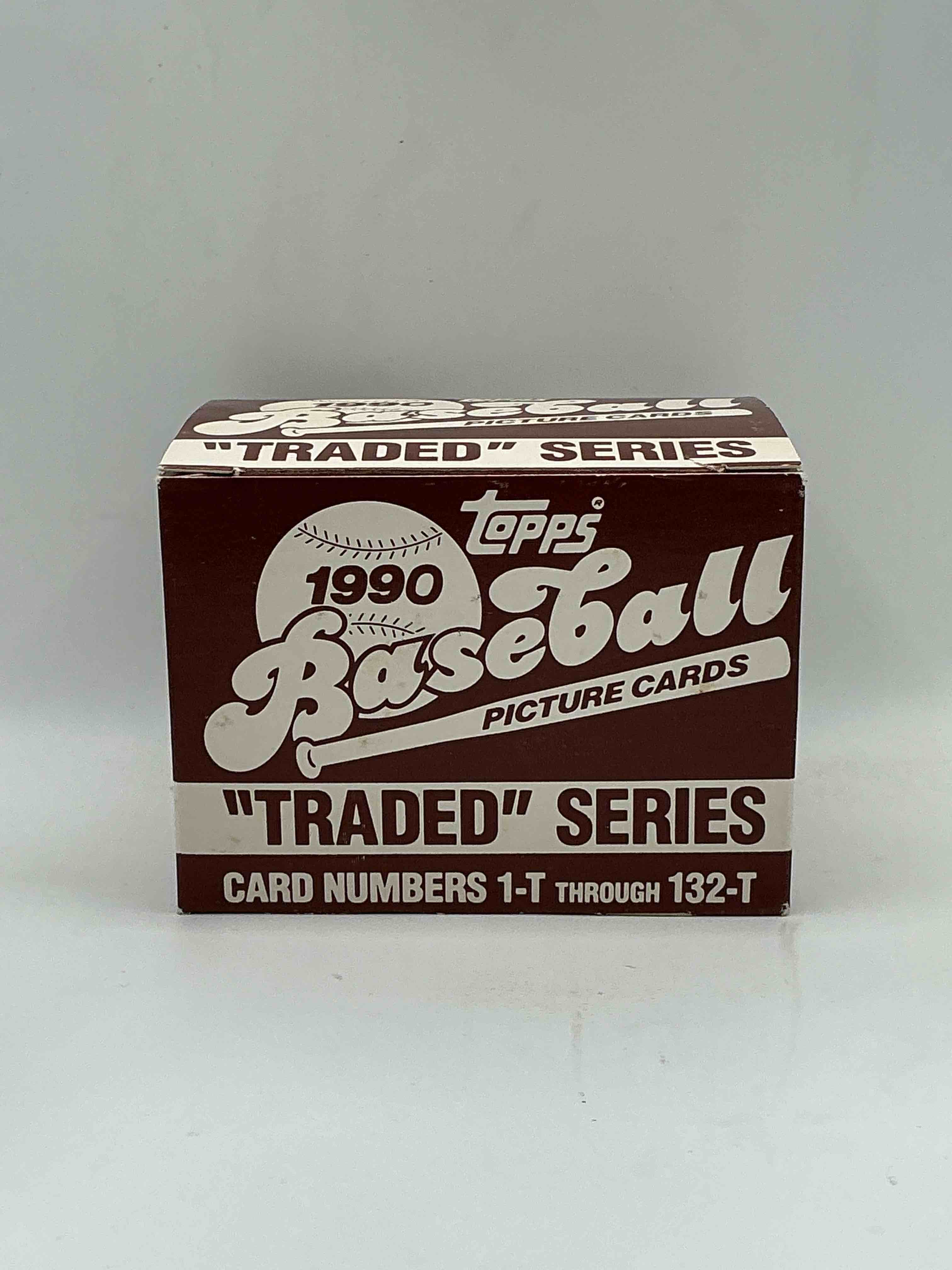 1990 topps baseball card complete unopened traded series, card numbers 1-t through 132-t. set is unopened (these sets were never factory sealed in plastic from manufacturer). set includes david justice traded rookie. great sports card memorabilia!