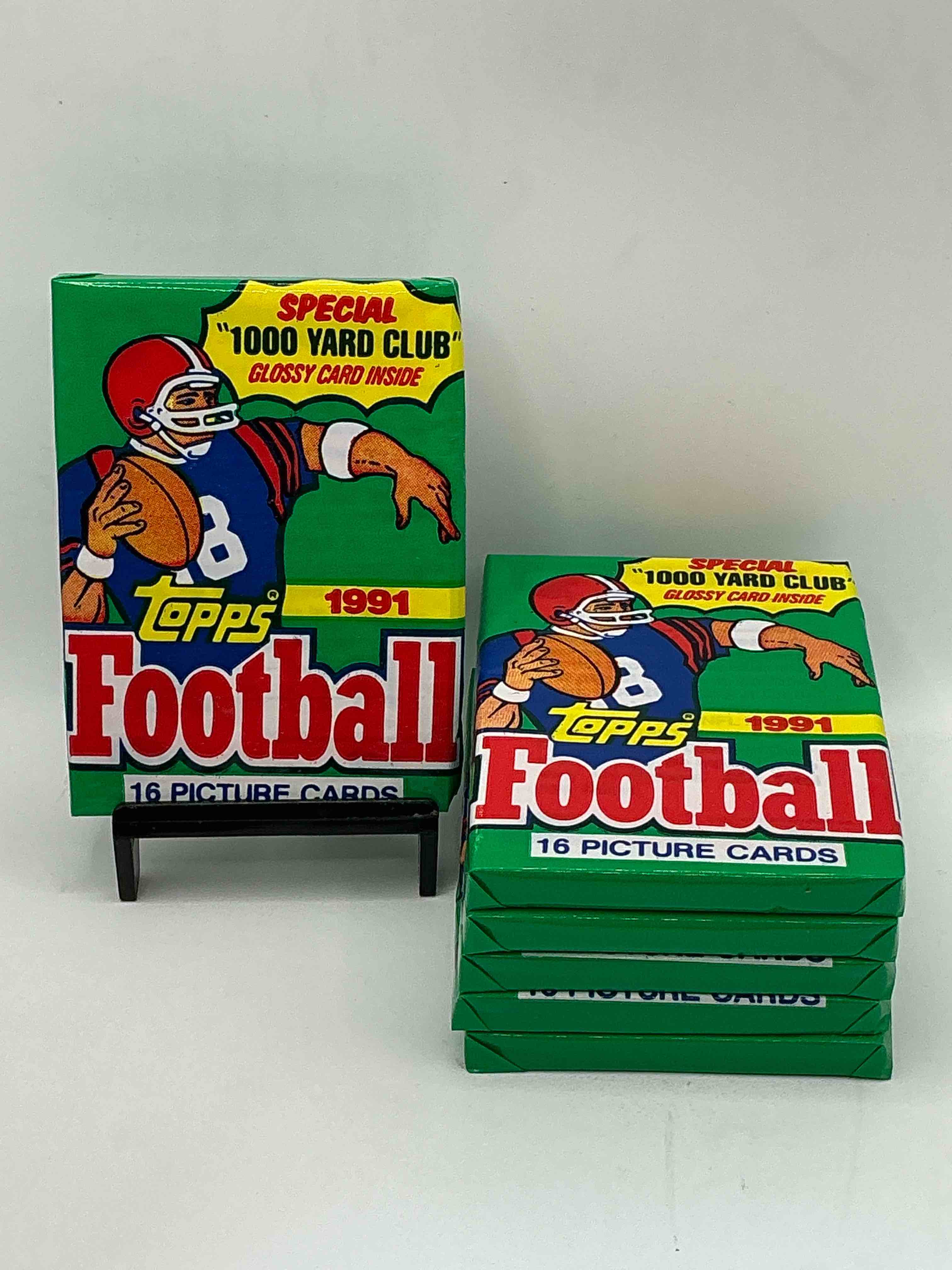 1991 topps football unopened sports card wax pack, direct from original retail case. search for early barry sanders, emmitt smith, jerry rice & joe montana!