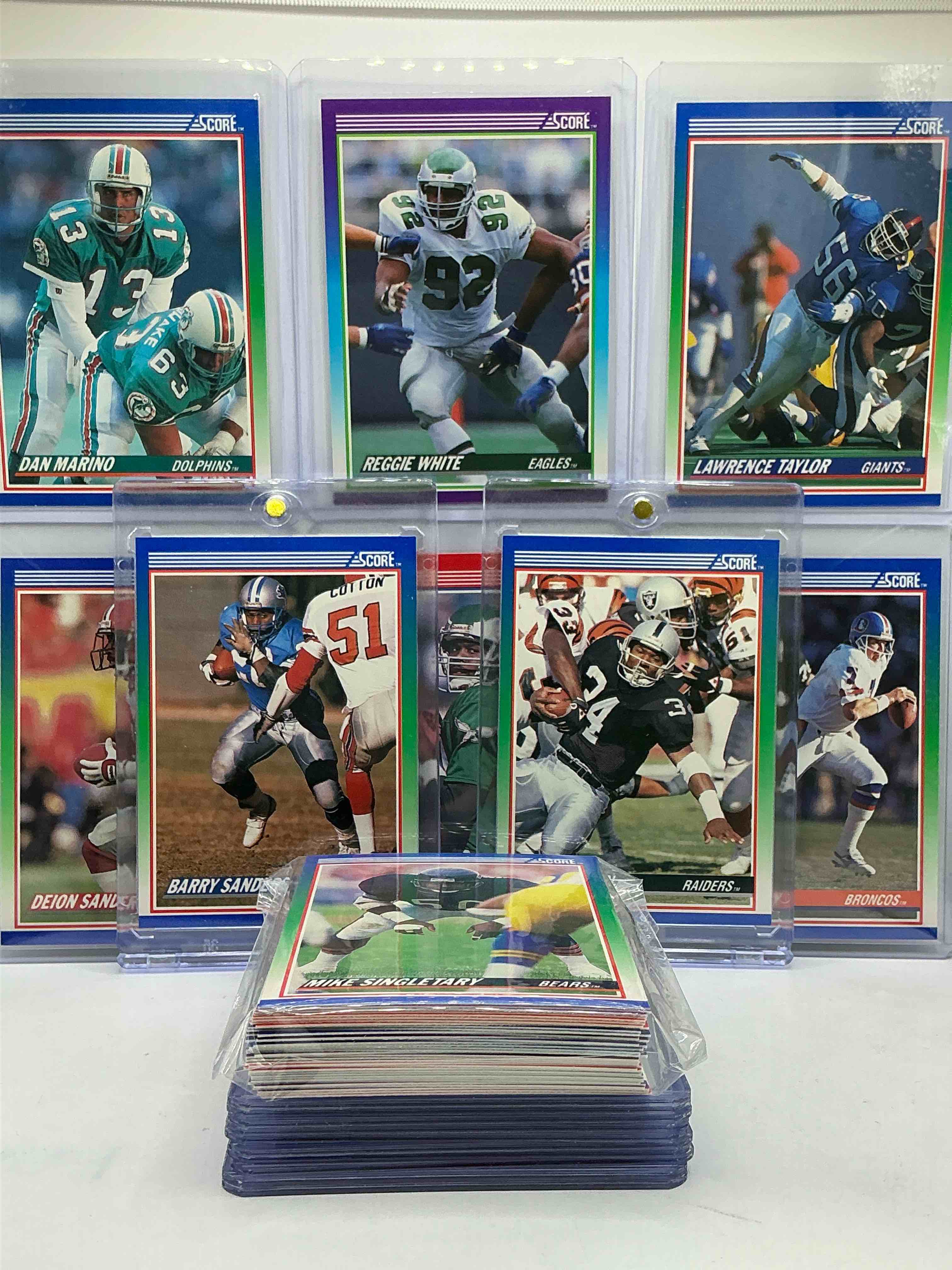 Condition photo showing New/Like New for 1991 score football cards! bo jackson, barry sanders, lawrence taylor, dan marino, jerry rice & more! 50 card football lot, filled with commons, legends, heroes & more! wow!