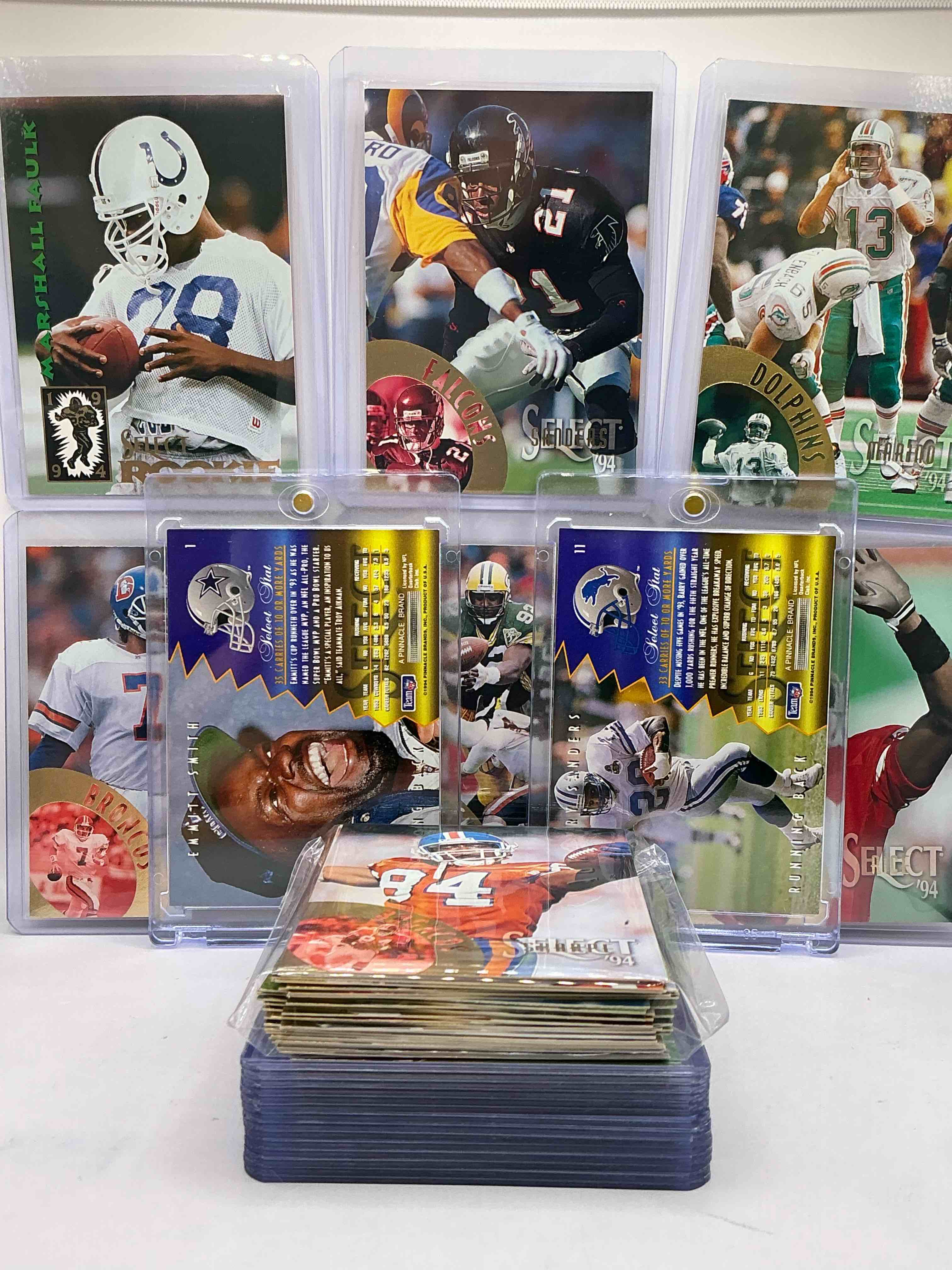 Condition photo showing New/Like New for 1994 pinnacle football 50 card lot, includes commons, legends, heroes & more! emmitt smith, barry sanders, randall cunningham, steve young, jerry rice, dan marino & more! 1994 football!