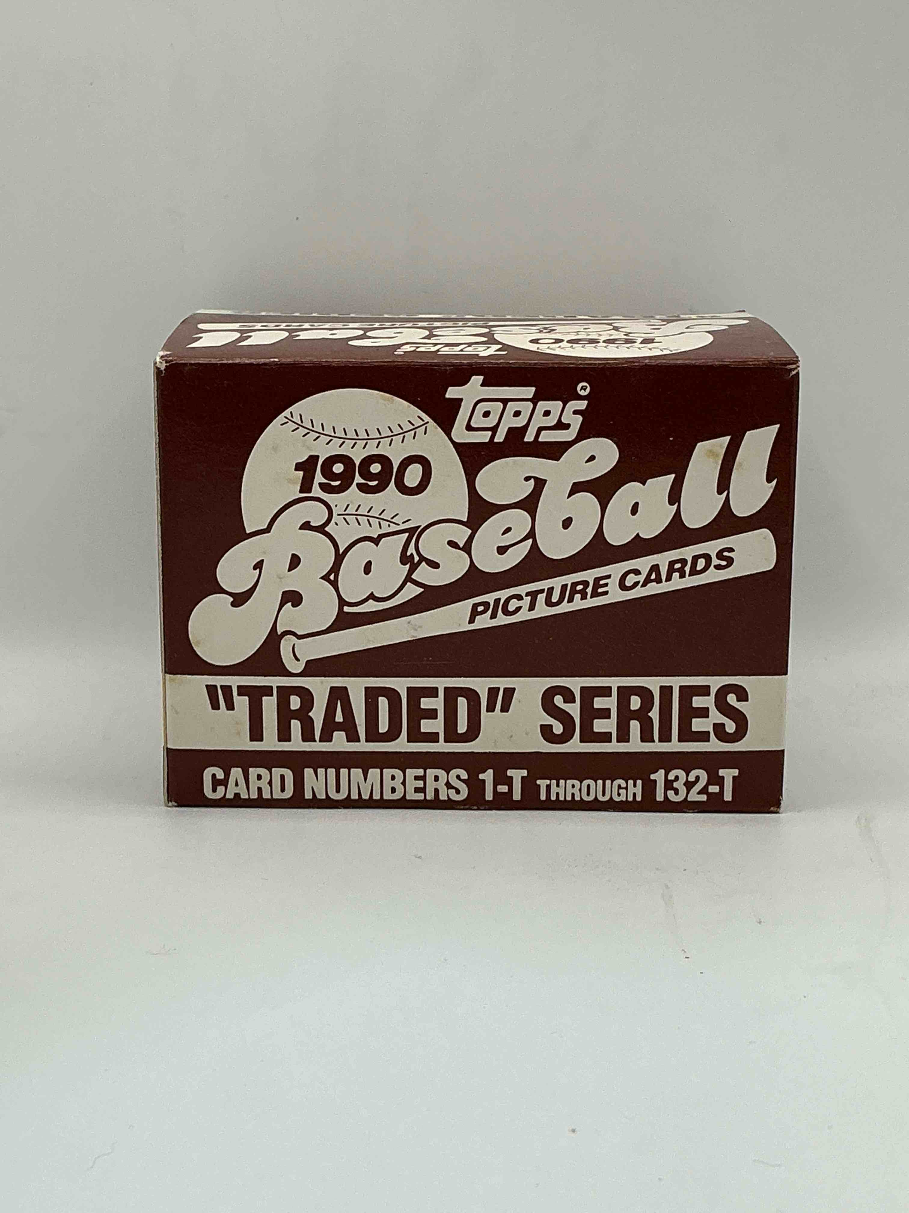 1990 topps baseball card complete unopened traded series, card numbers 1-t through 132-t. set is unopened (these sets were never factory sealed in plastic from manufacturer). set includes david justice traded rookie. great sports card memorabilia!