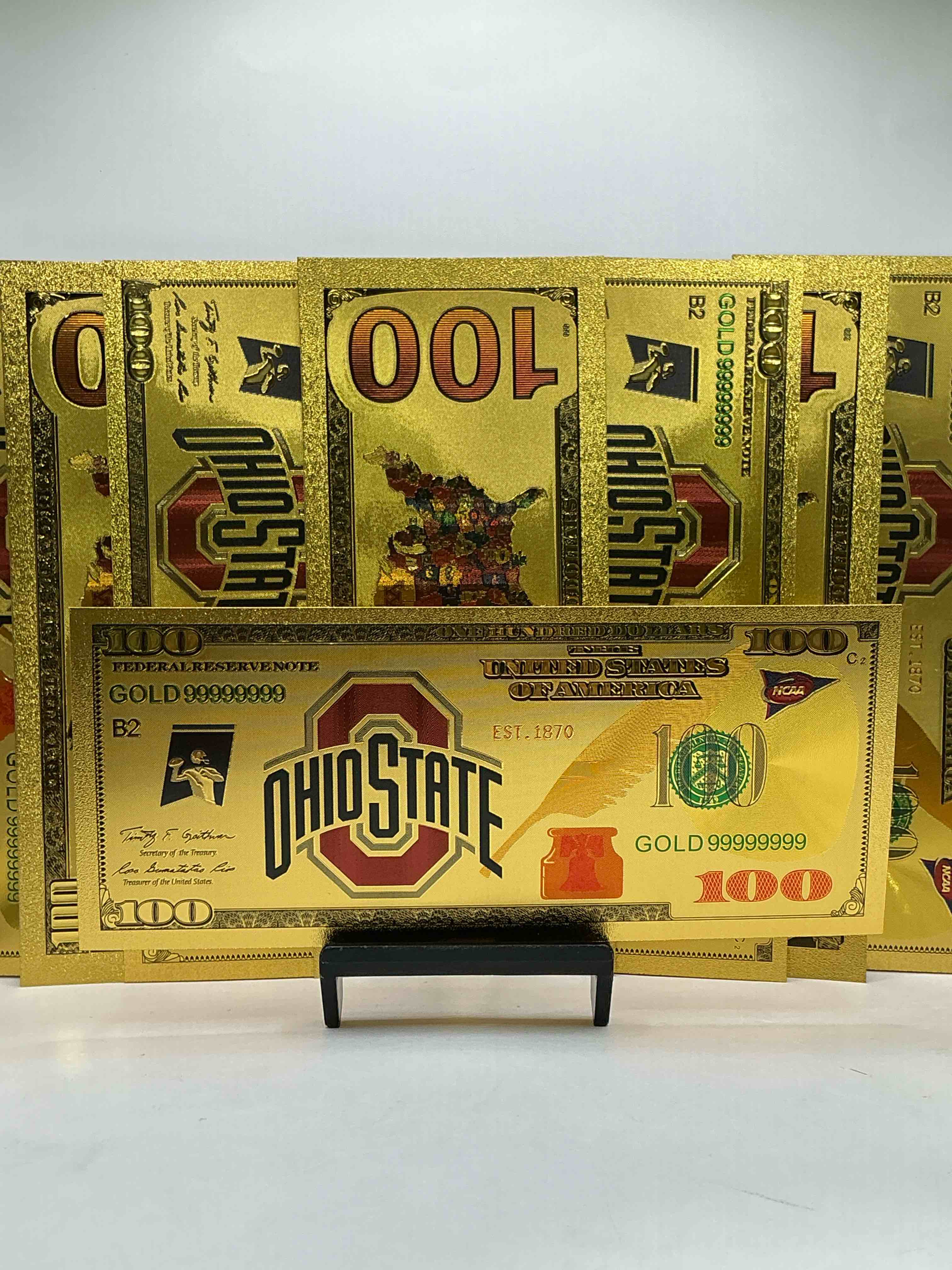 ohio state university collectible memorabilia! super cool, gold in color 100 dollar commemorative ohio state university bill! cool designs on front & back of bill! osu fans rejoice, cool memorabilia! plastic bills with cool designs! 