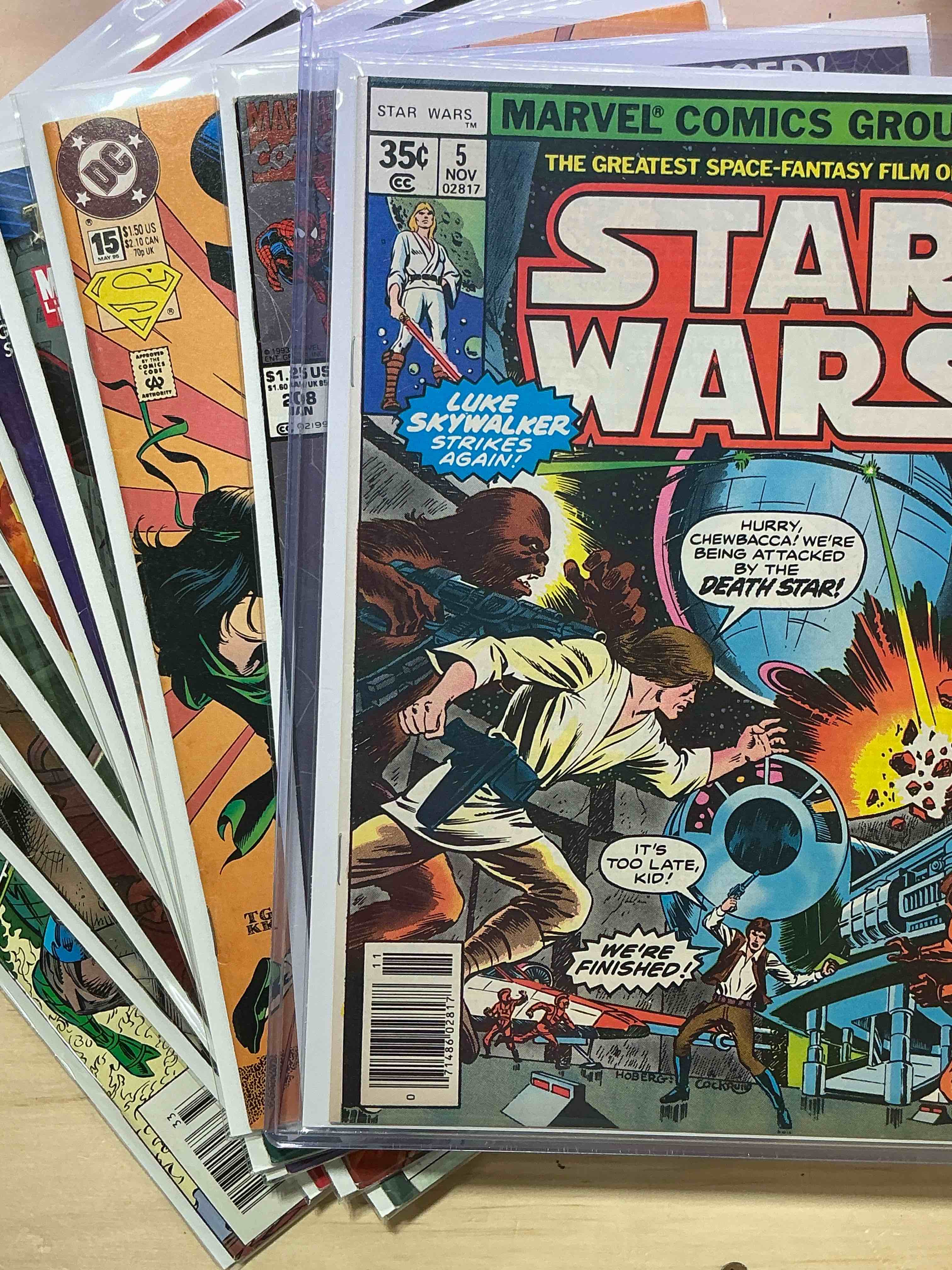 Comic Book Craziness!  Includes Original 1977 Star Wars Comic WOW!  Great Collection Of Comic Books Spanning Many Decades,  All Encased With Protective Sleeves & Backing.  Generally In Good / Fine Condition For Age.  A Great Way To get An Eclectic Comic Collection Spanning Generations!