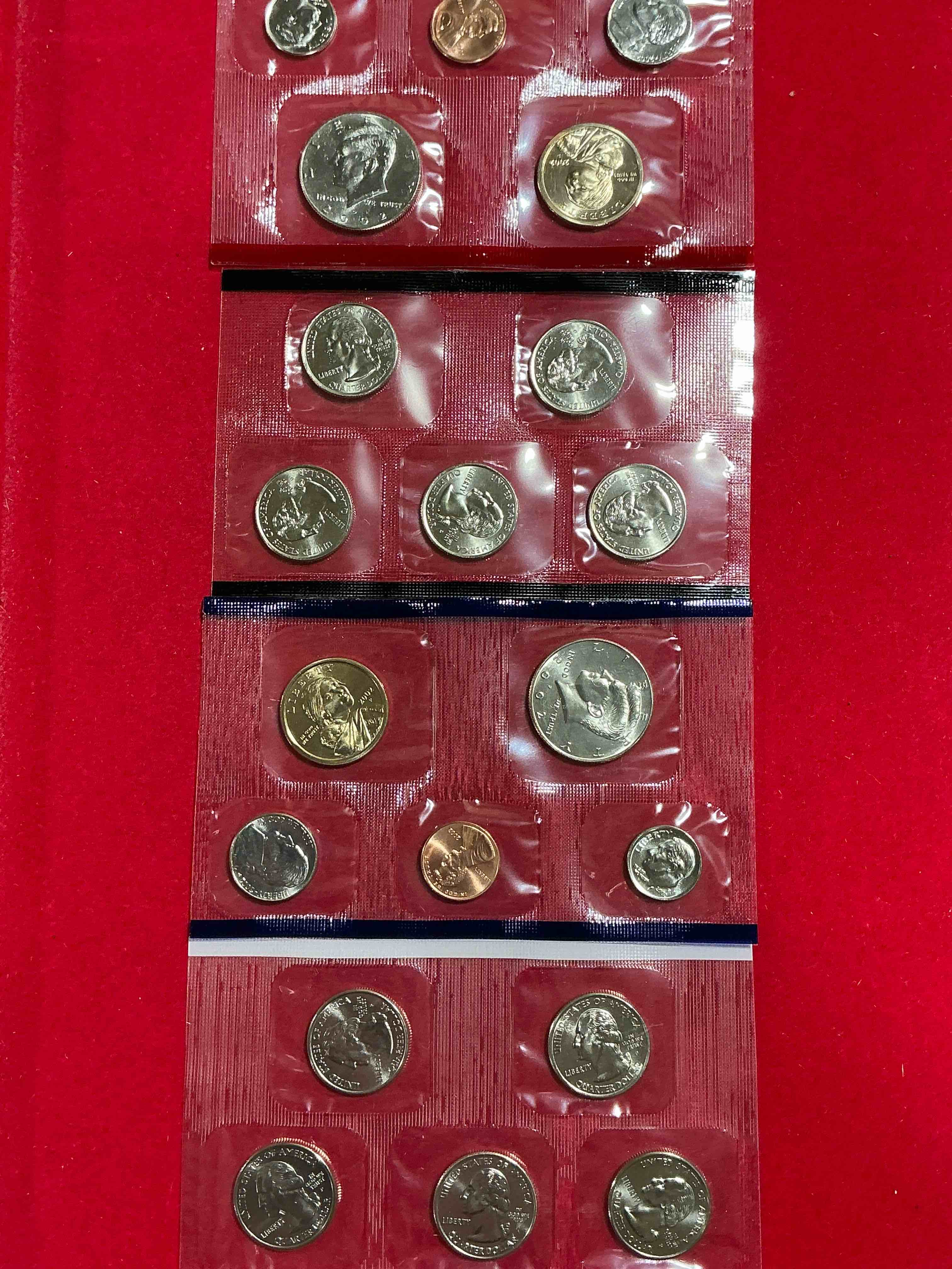2002 uncirculated mint set! 20 coin mint set with ohio & indiana state quarters! half dollars, one dollar coins, quarters, nickels, dimes & pennies! 20 coin uncirculated mint set! 