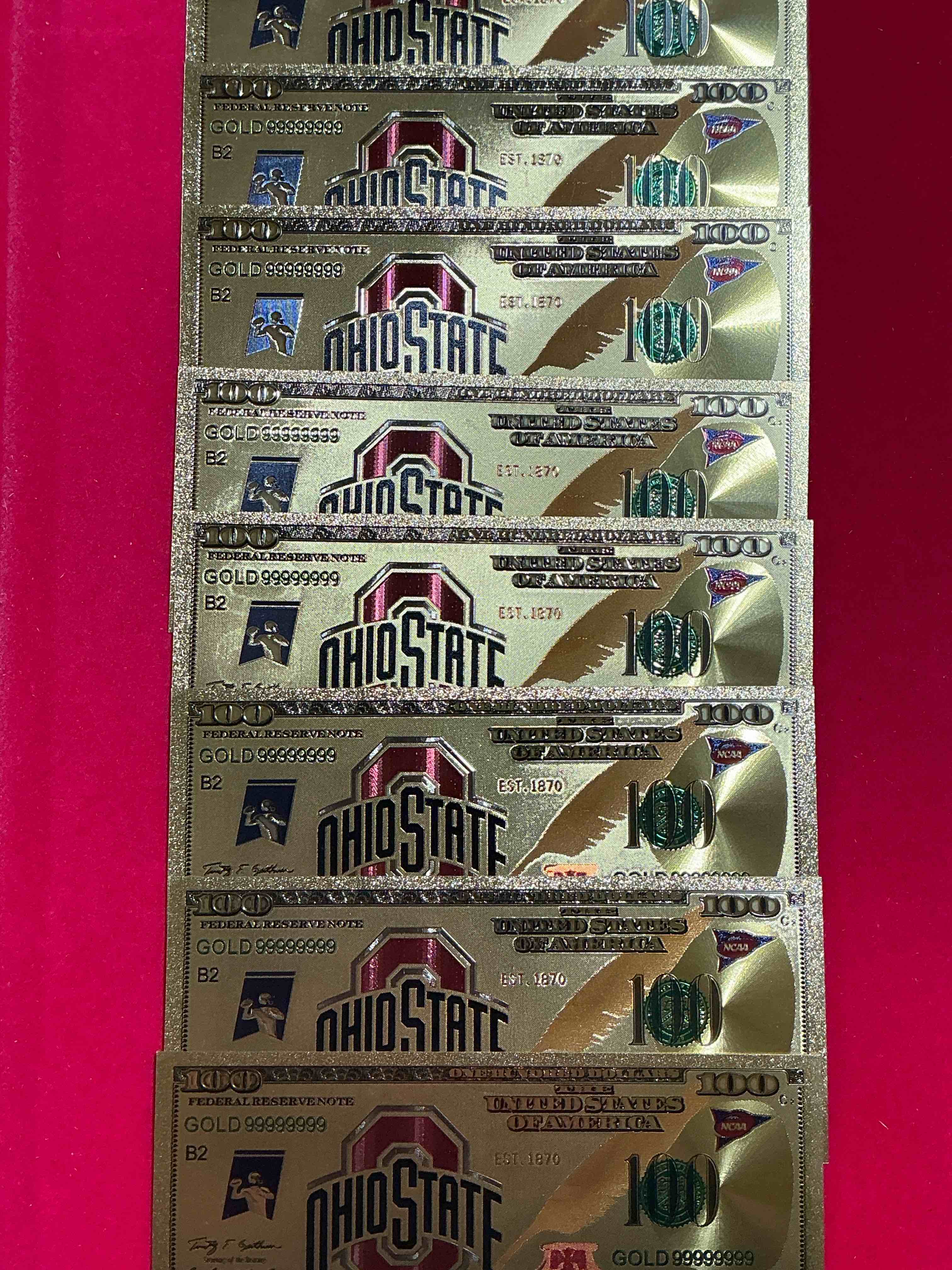 ohio state university collectible memorabilia! super cool, gold in color 100 dollar commemorative ohio state university bill! cool designs on front & back of bill! osu fans rejoice, cool memorabilia! plastic bills with cool designs! 