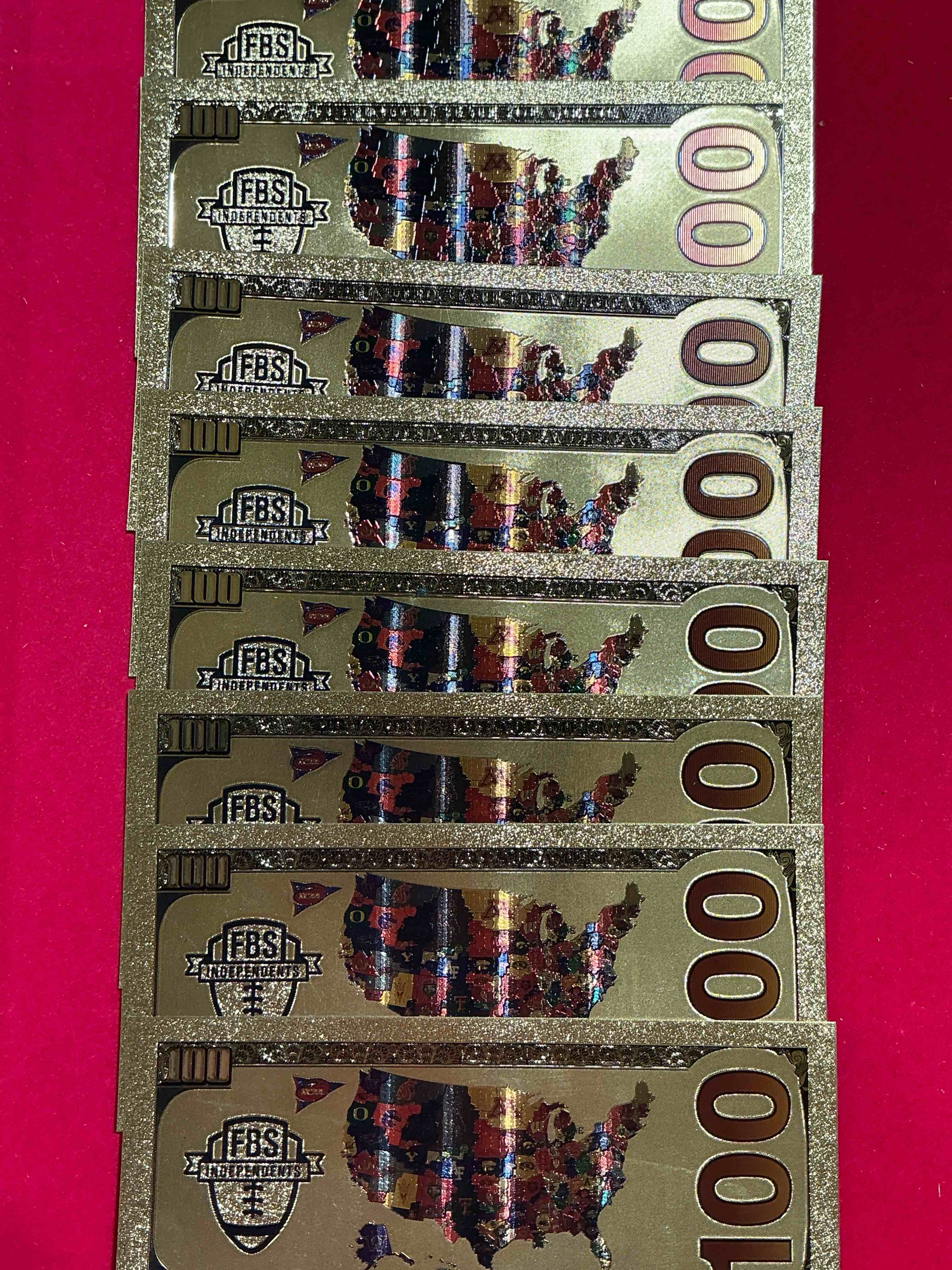 Condition photo showing New/Like New for ohio state university collectible memorabilia! super cool, gold in color 100 dollar commemorative ohio state university bill! cool designs on front & back of bill! osu fans rejoice, cool memorabilia! plastic bills with cool designs! 