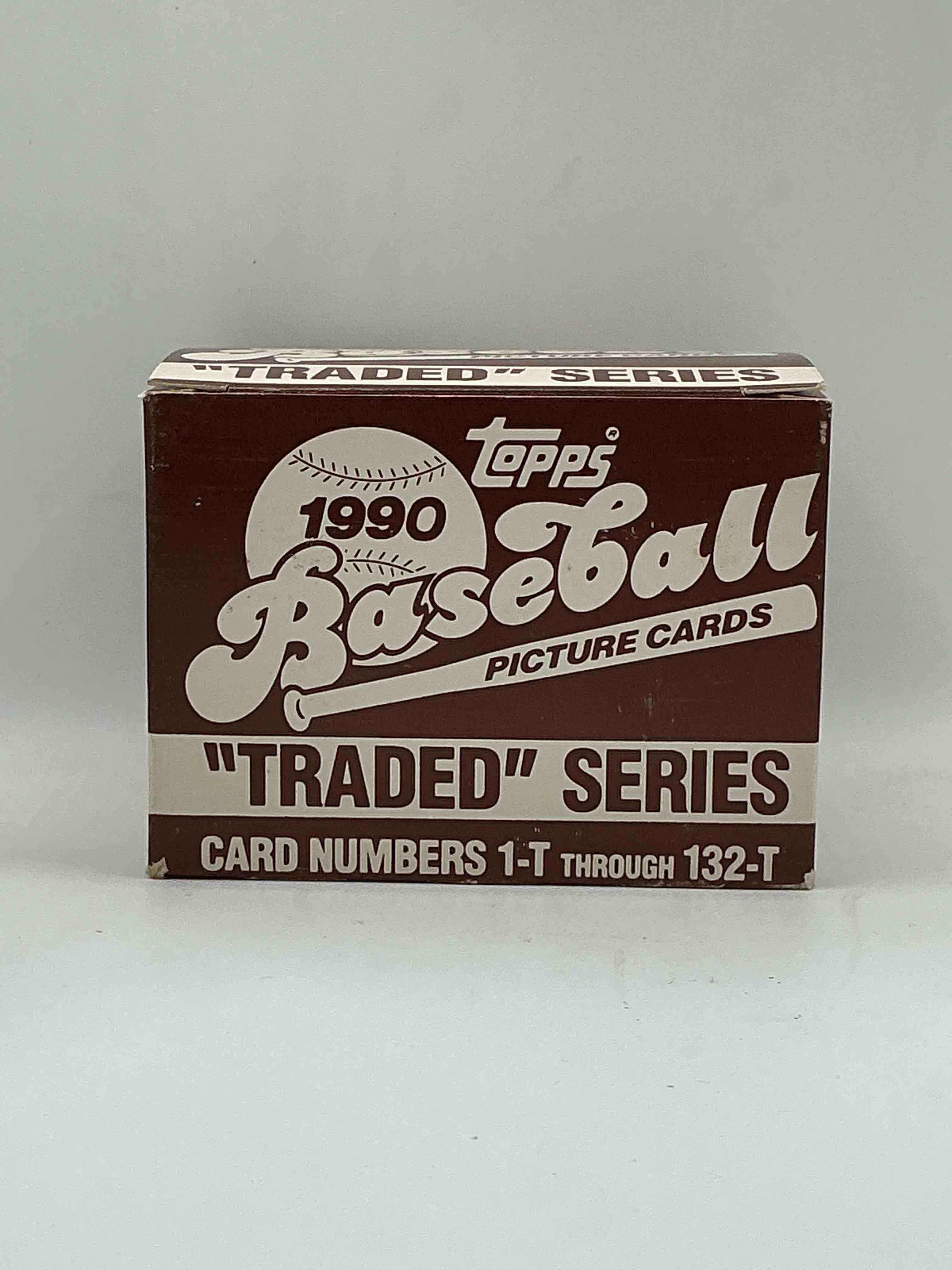 1990 topps baseball card complete unopened traded series, card numbers 1-t through 132-t. set is unopened (these sets were never factory sealed in plastic from manufacturer). set includes david justice traded rookie. great sports card memorabilia!