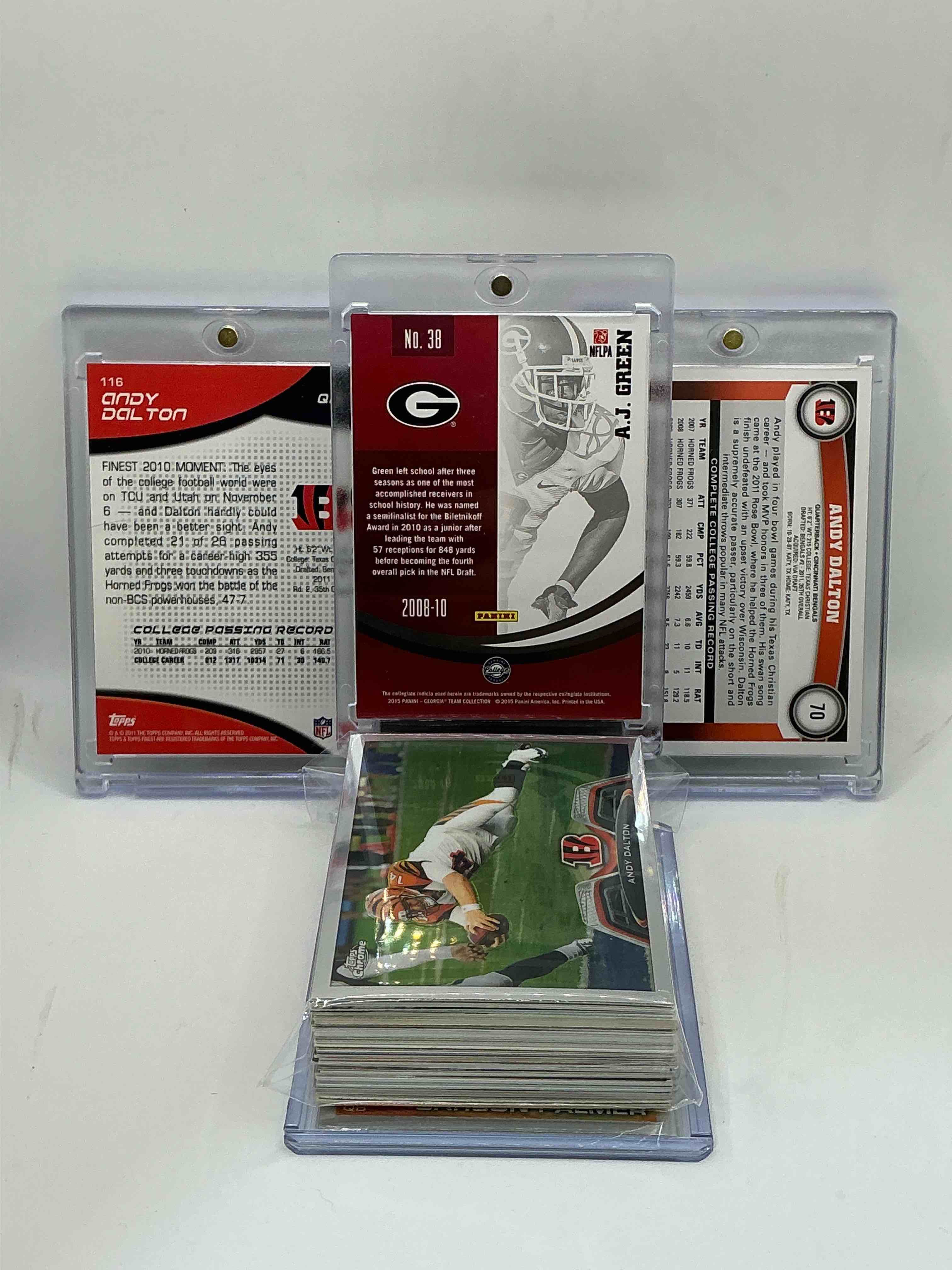 Condition photo showing New/Like New for bengals throwback bonanza! 2015 panini draft picks aj green numbered 15/25! 2011 topps finest rookie andy dalton! 2011 topps base rookie andy dalton! wow! along with 50 other bengals heroes, legends, rookies & commons!
