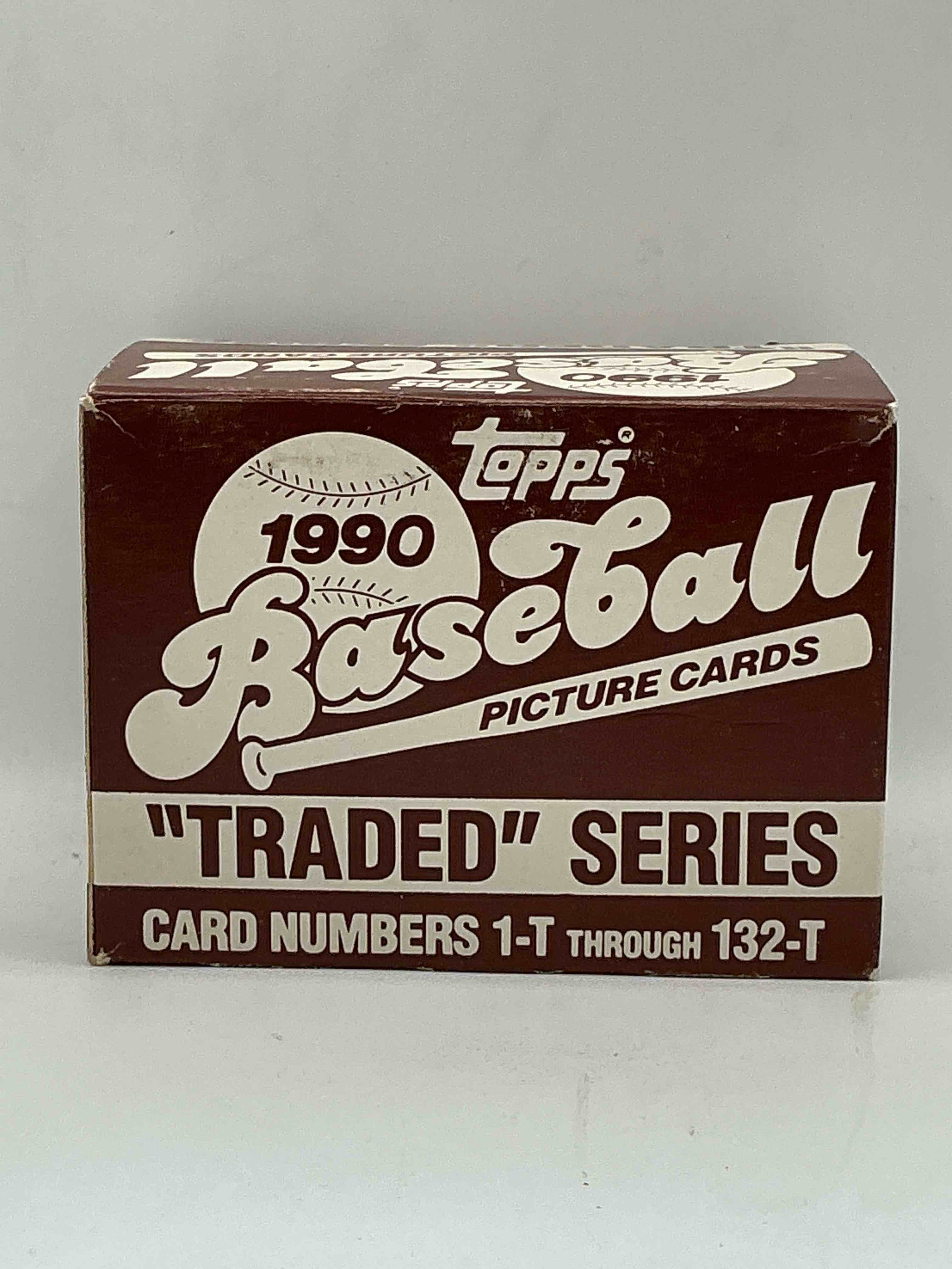 1990 topps baseball card complete unopened traded series, card numbers 1-t through 132-t. set is unopened (these sets were never factory sealed in plastic from manufacturer). set includes david justice traded rookie. great sports card memorabilia!