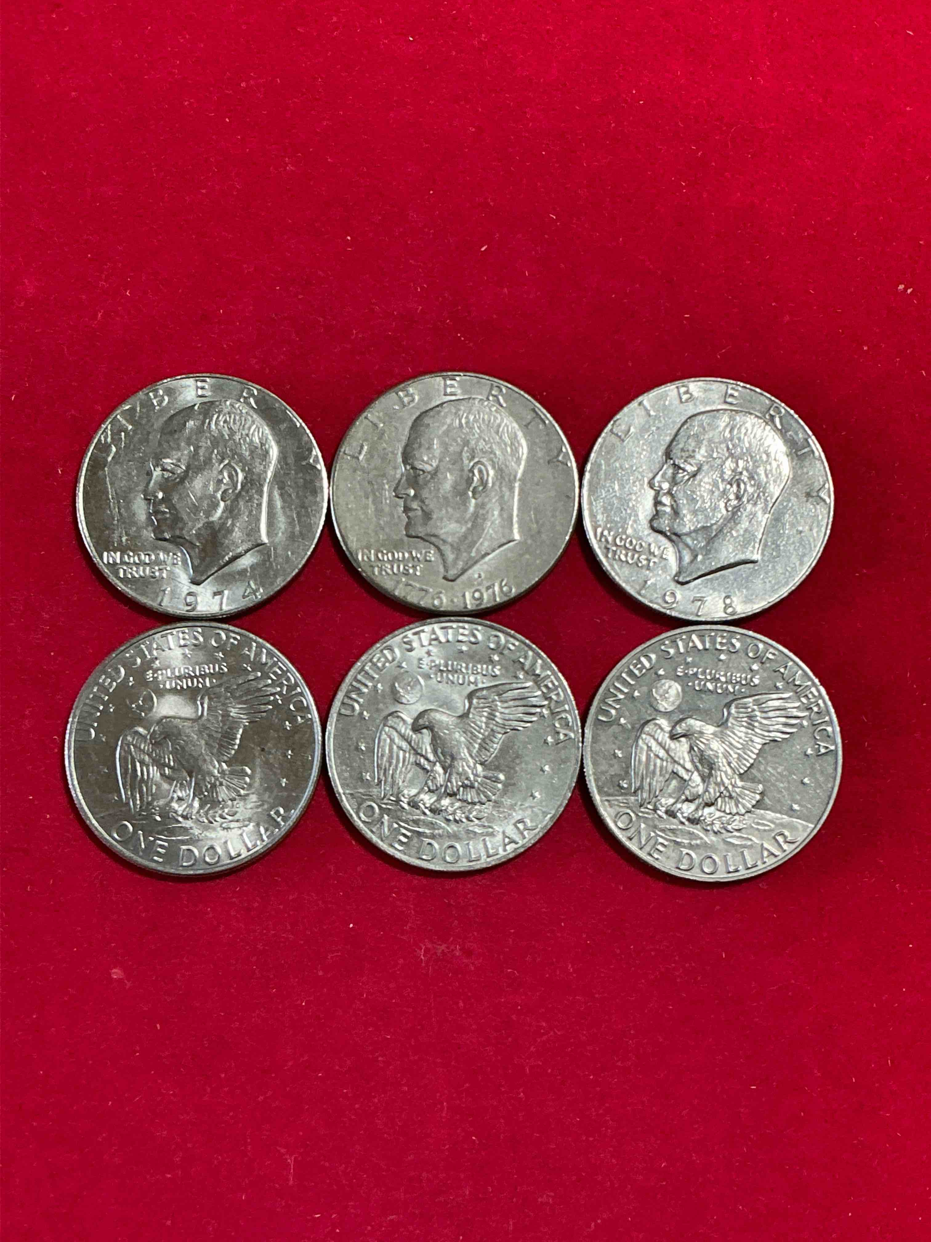 eisenhower dollars! here’s six circulated “ike” dollars! up for auction are ike one dollar coins from different years! 1976! awesome ike dollars!