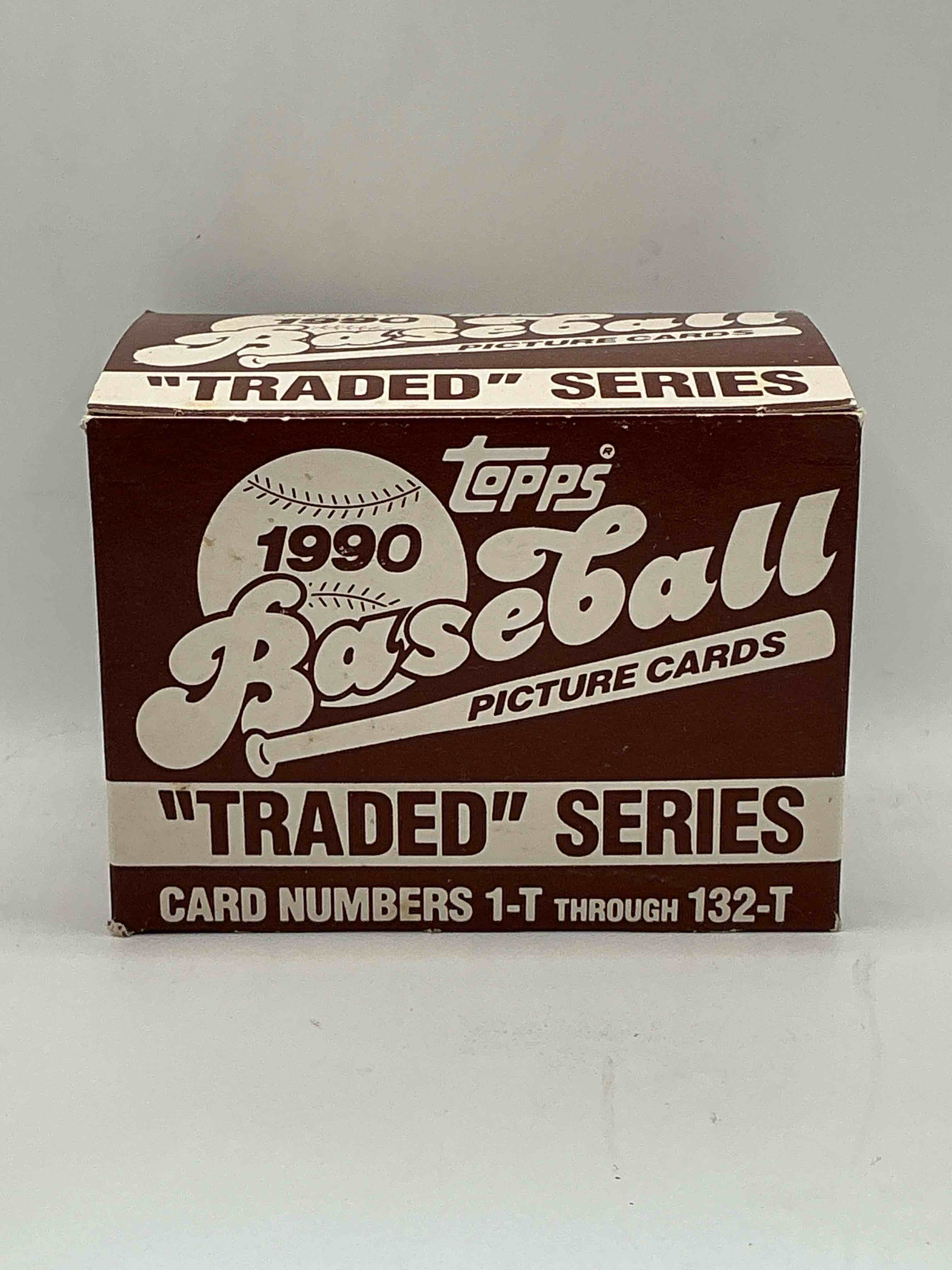 1990 topps baseball card complete unopened traded series, card numbers 1-t through 132-t. set is unopened (these sets were never factory sealed in plastic from manufacturer). set includes david justice traded rookie. great sports card memorabilia!