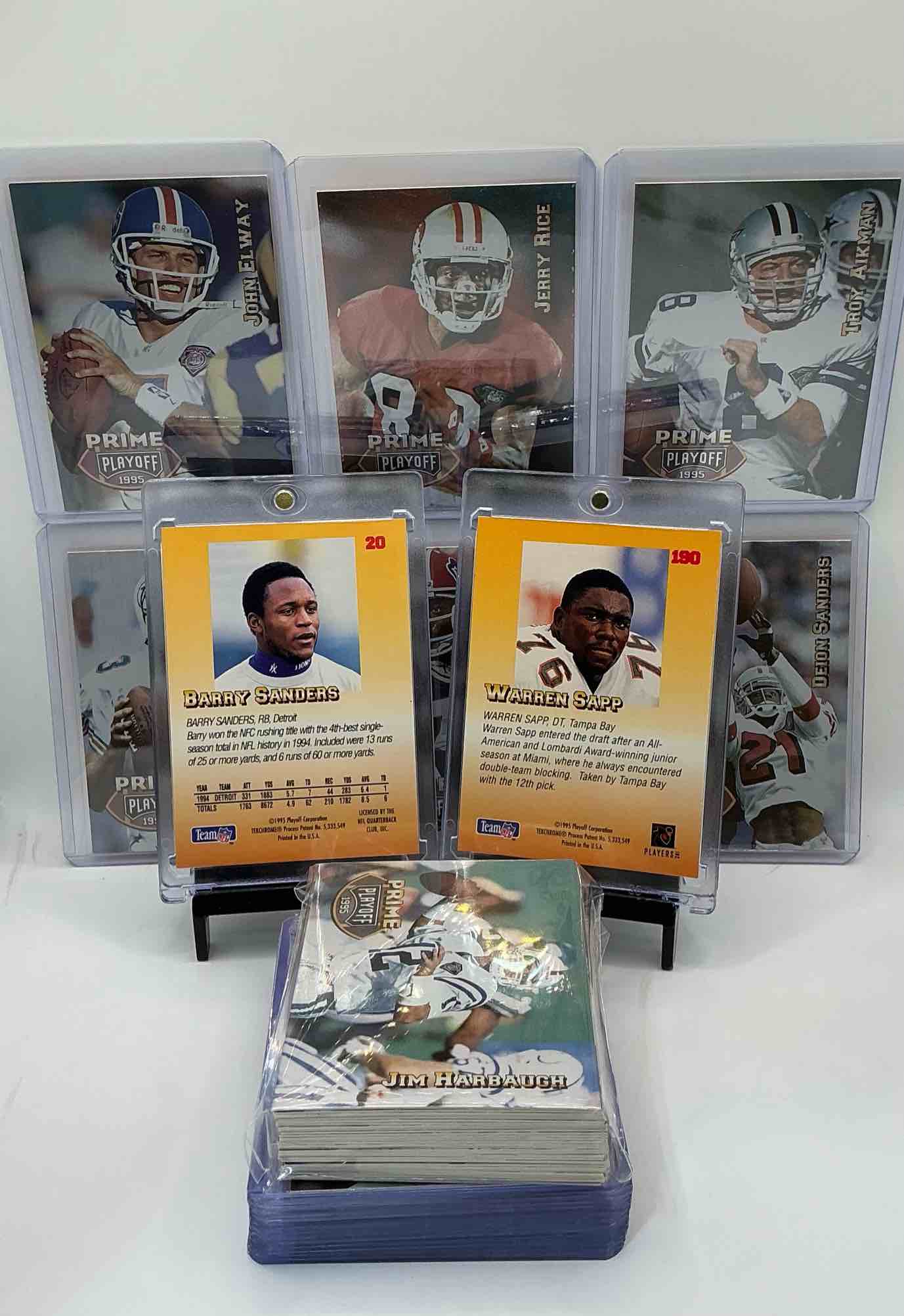 Condition photo showing New/Like New for 1995 playoff football card craziness! warren sapp rookie! along with all the best players from the 90’s! barry sanders, john elway, dan marino, bruce smith & so many more all included in the 50 card lot!