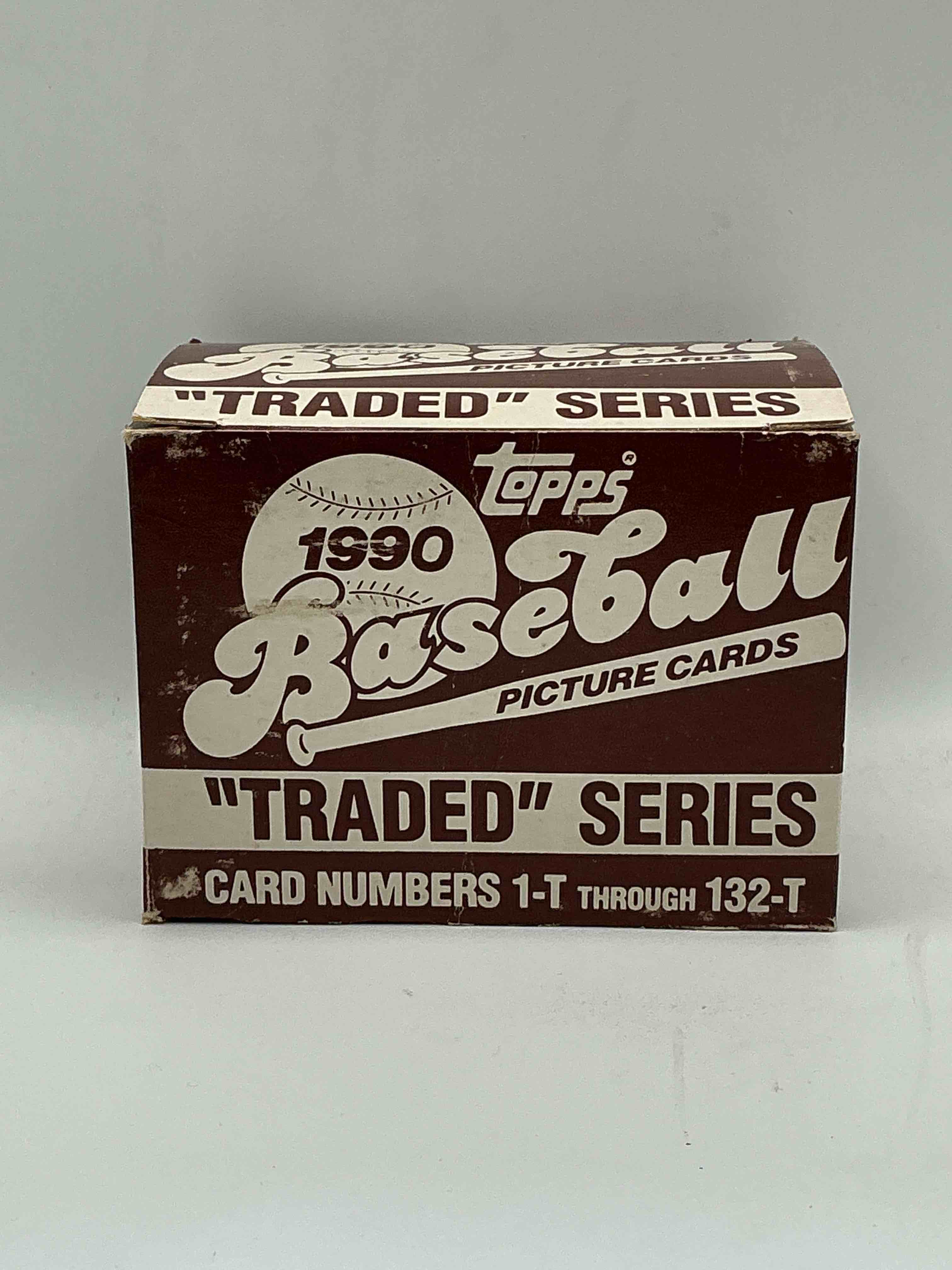 1990 topps baseball card complete unopened traded series, card numbers 1-t through 132-t. set is unopened (these sets were never factory sealed in plastic from manufacturer). set includes david justice traded rookie. great sports card memorabilia!