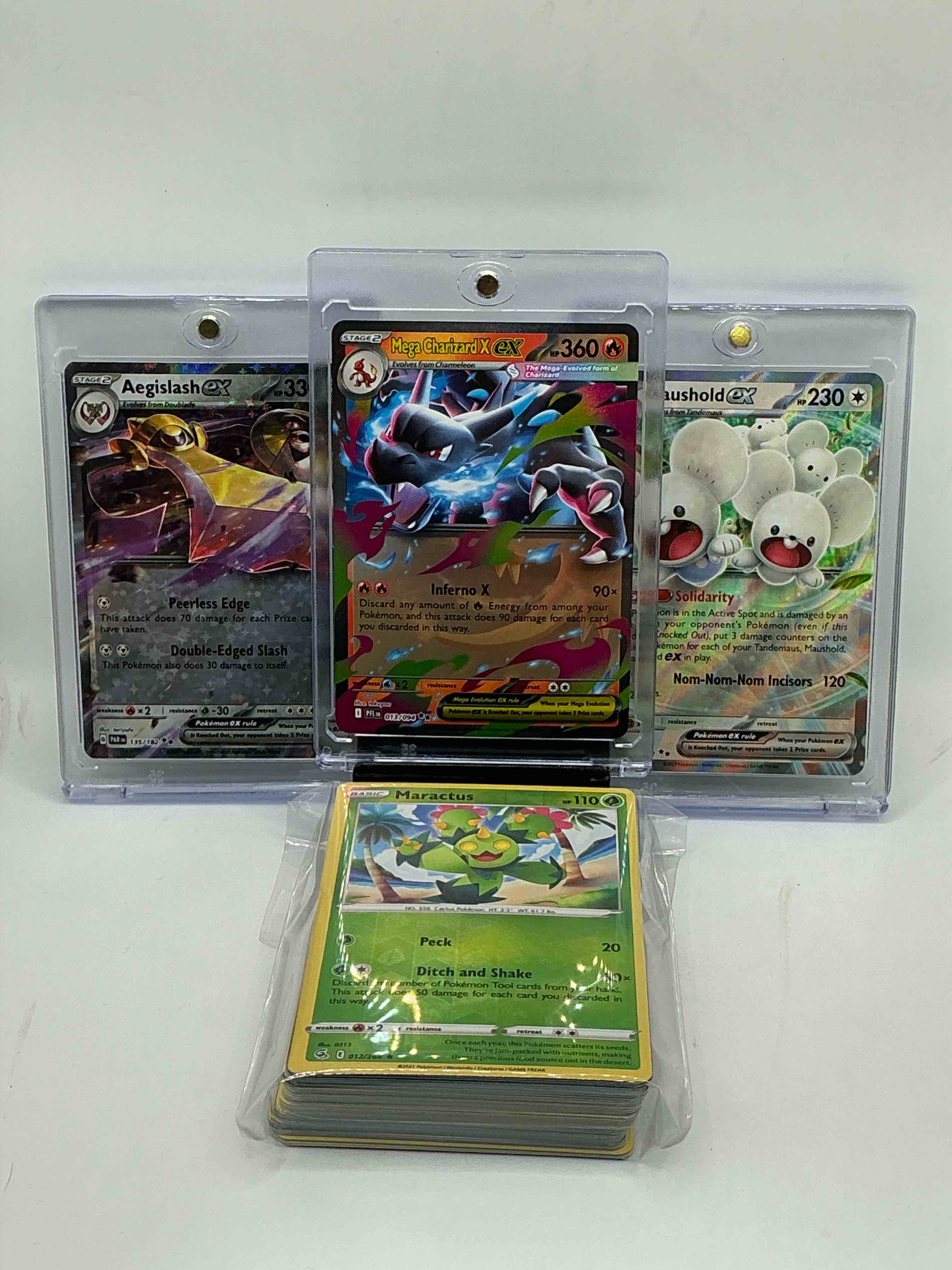 pokémon palooza! mega charizard x ex! aegislash ex! maushold ex! along with 50 other pokémon heroes, holos, legends & commons- including 1 stage two rare holographic, 2 stage one rare holographic, 3 basic rare holographic, 4 common/ uncommon holographics (all stages), 2 stage two non holographic & 2 rares! also includes 36 non holo common/ uncommon basic & first stage cards trainers & energy too! perfect set for collectors & enthusiasts!