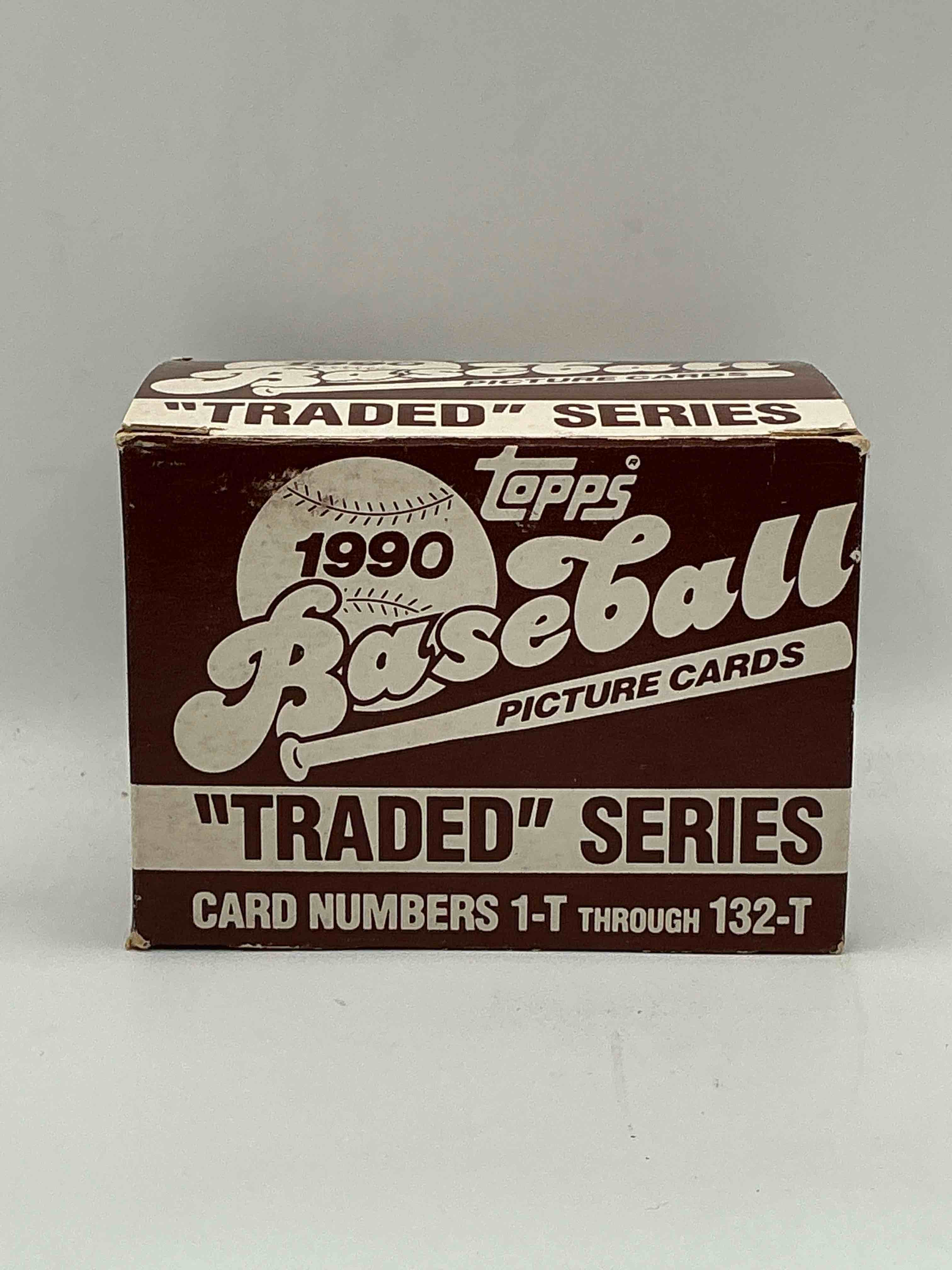 1990 topps baseball card complete unopened traded series, card numbers 1-t through 132-t. set is unopened (these sets were never factory sealed in plastic from manufacturer). set includes david justice traded rookie. great sports card memorabilia!