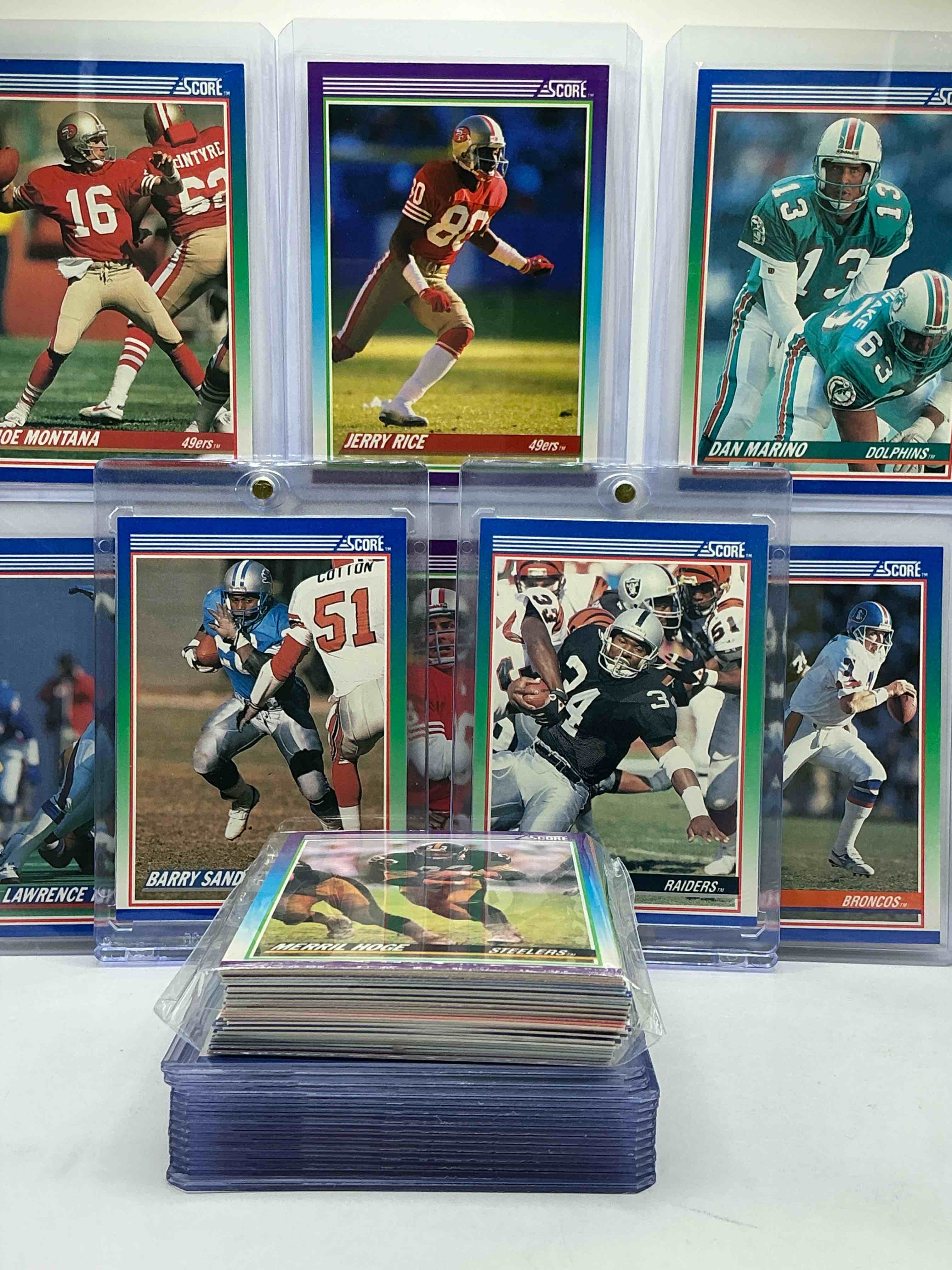 Condition photo showing New/Like New for 1990 score football cards! bo jackson, barry sanders, lawrence taylor, dan marino, jerry rice & more! 50 card football lot, filled with commons, legends, heroes & more! wow!