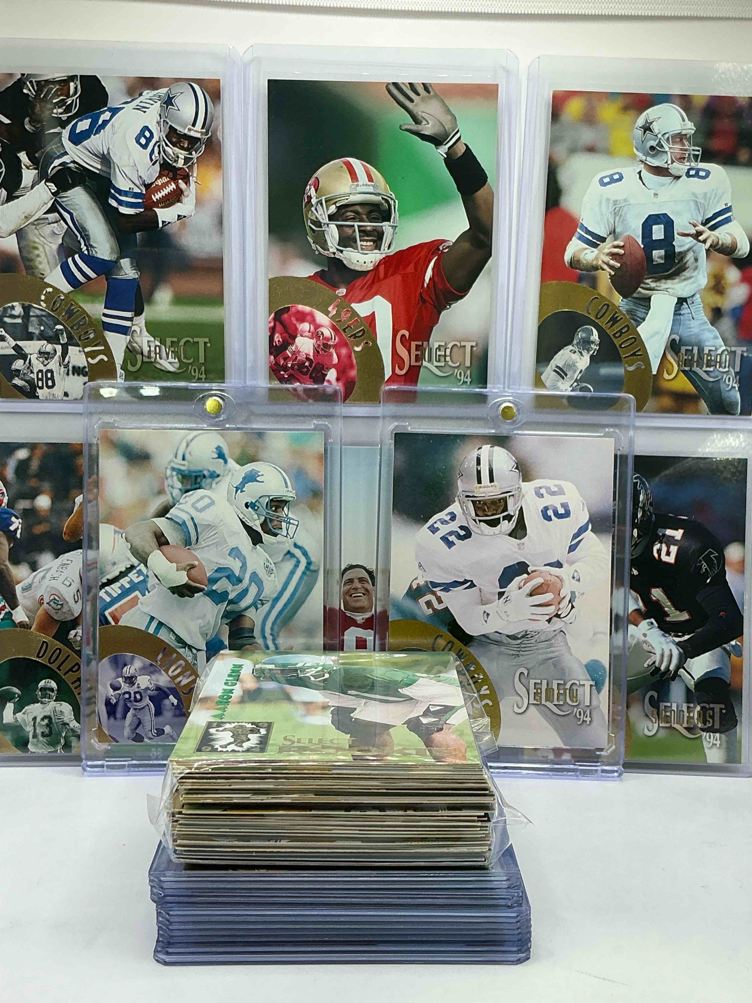 Condition photo showing New/Like New for 1994 pinnacle football 50 card lot, includes commons, legends, heroes & more! emmitt smith, barry sanders, michael irvin, steve young, jerry rice, dan marino & more! 1994 football!