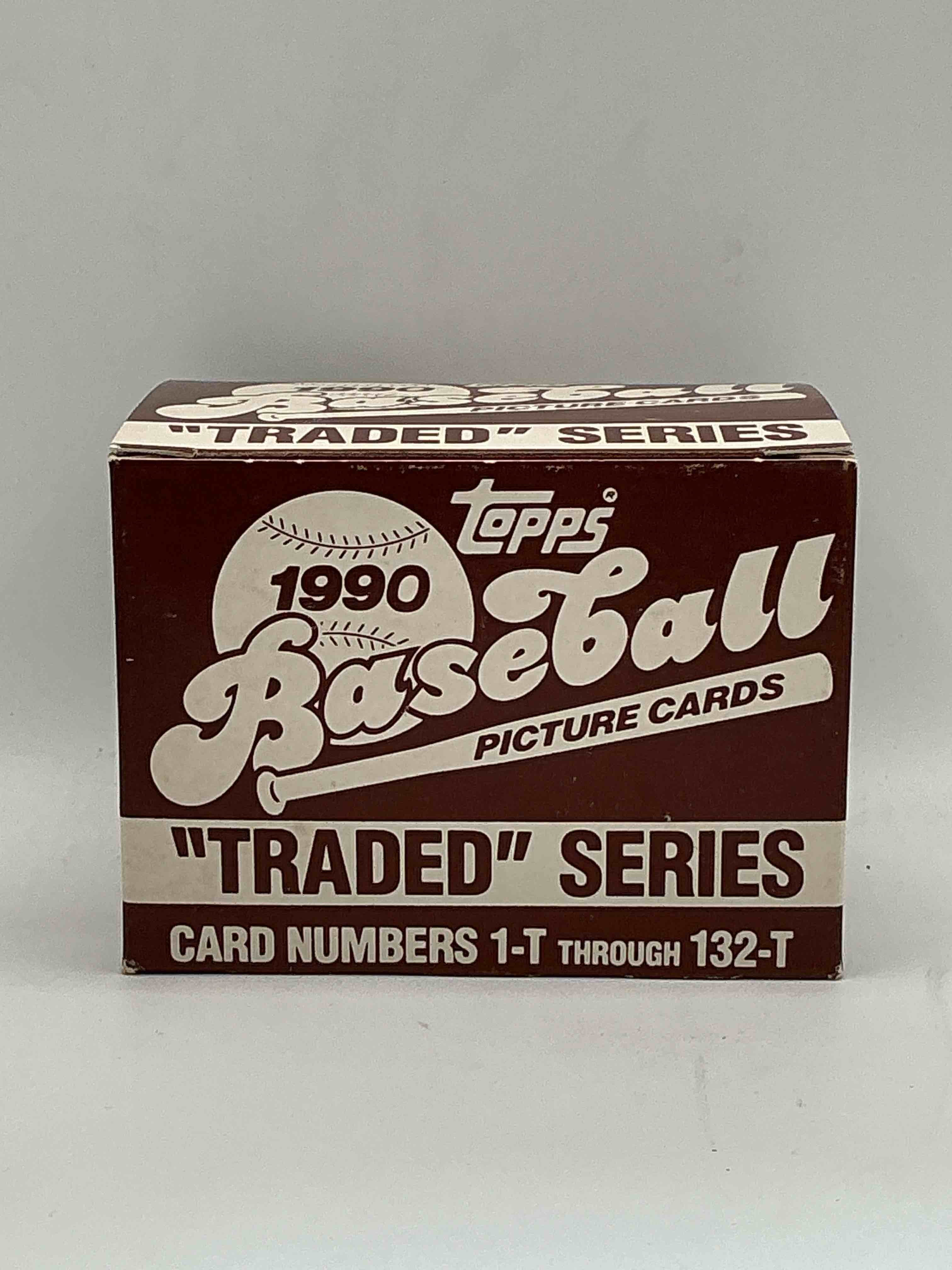 1990 topps baseball card complete unopened traded series, card numbers 1-t through 132-t. set is unopened (these sets were never factory sealed in plastic from manufacturer). set includes david justice traded rookie. great sports card memorabilia!