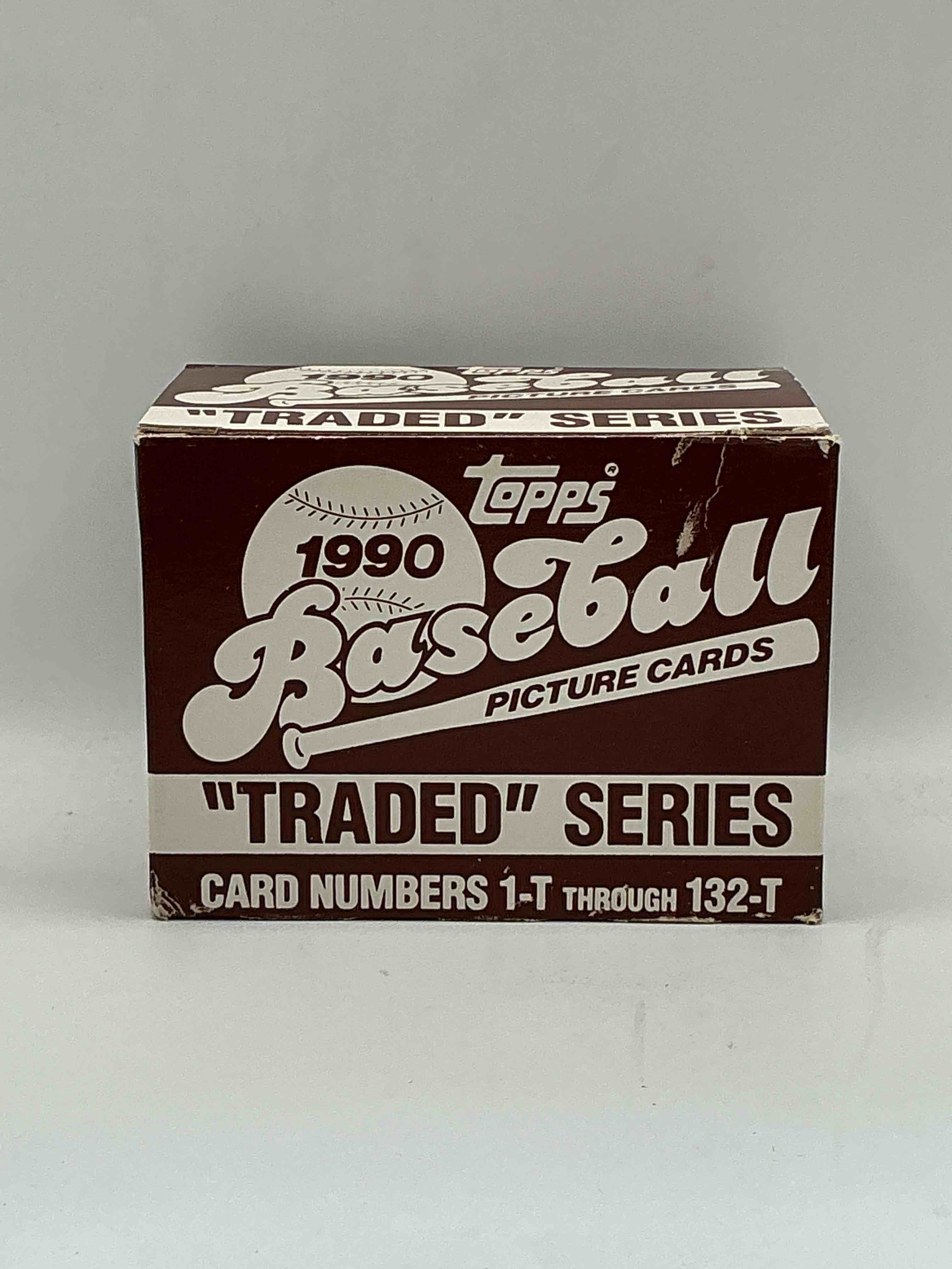 1990 topps baseball card complete unopened traded series, card numbers 1-t through 132-t. set is unopened (these sets were never factory sealed in plastic from manufacturer). set includes david justice traded rookie. great sports card memorabilia!