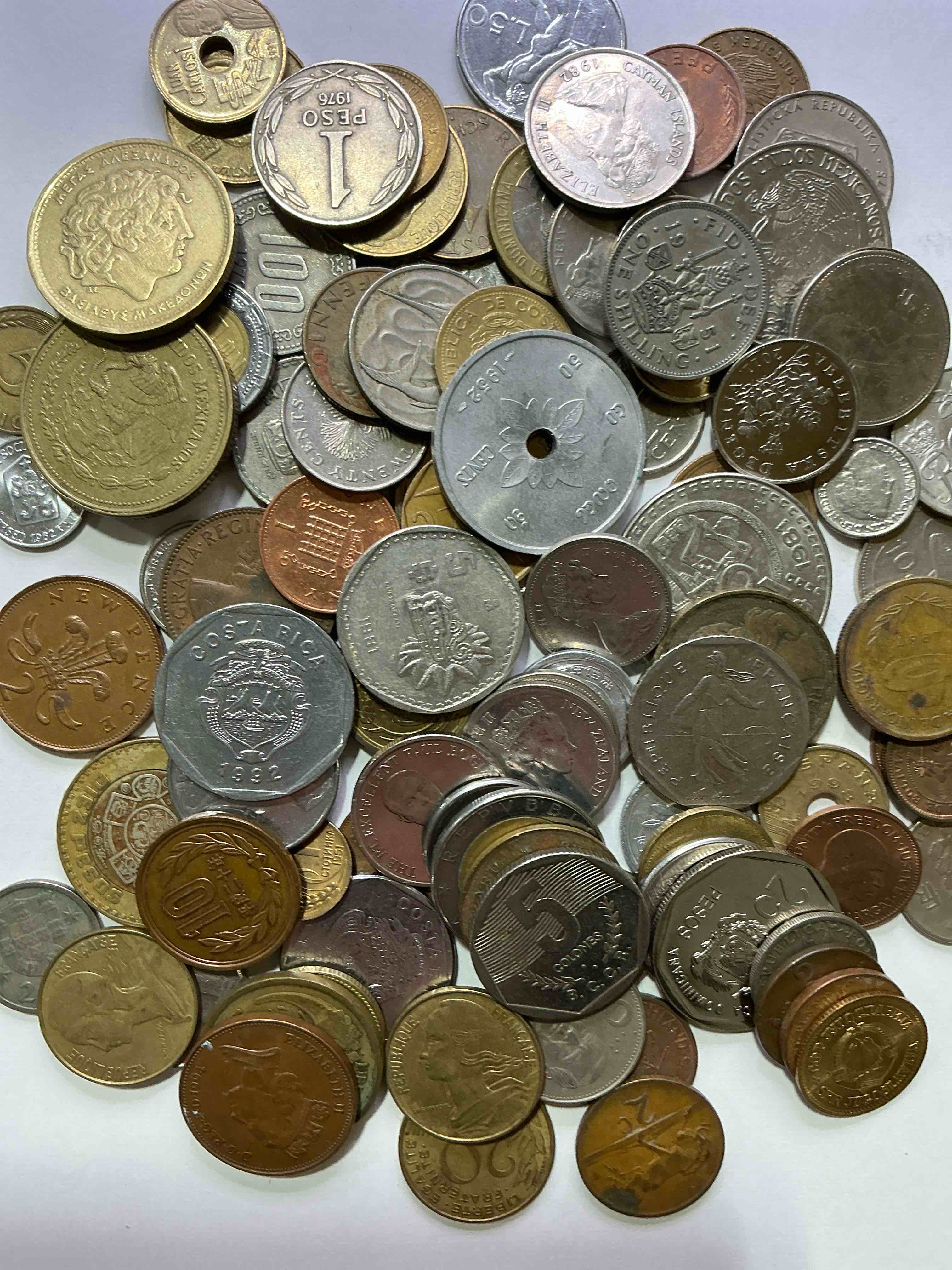 Condition photo showing Good Condition for world coins, antique & vintage! each lot is unique! many different years, countries, sizes & exotic places. this cool collection of antique coins from around the world is loads of fun! have fun identifying each coin & country as a great educational tool! a great investment too!