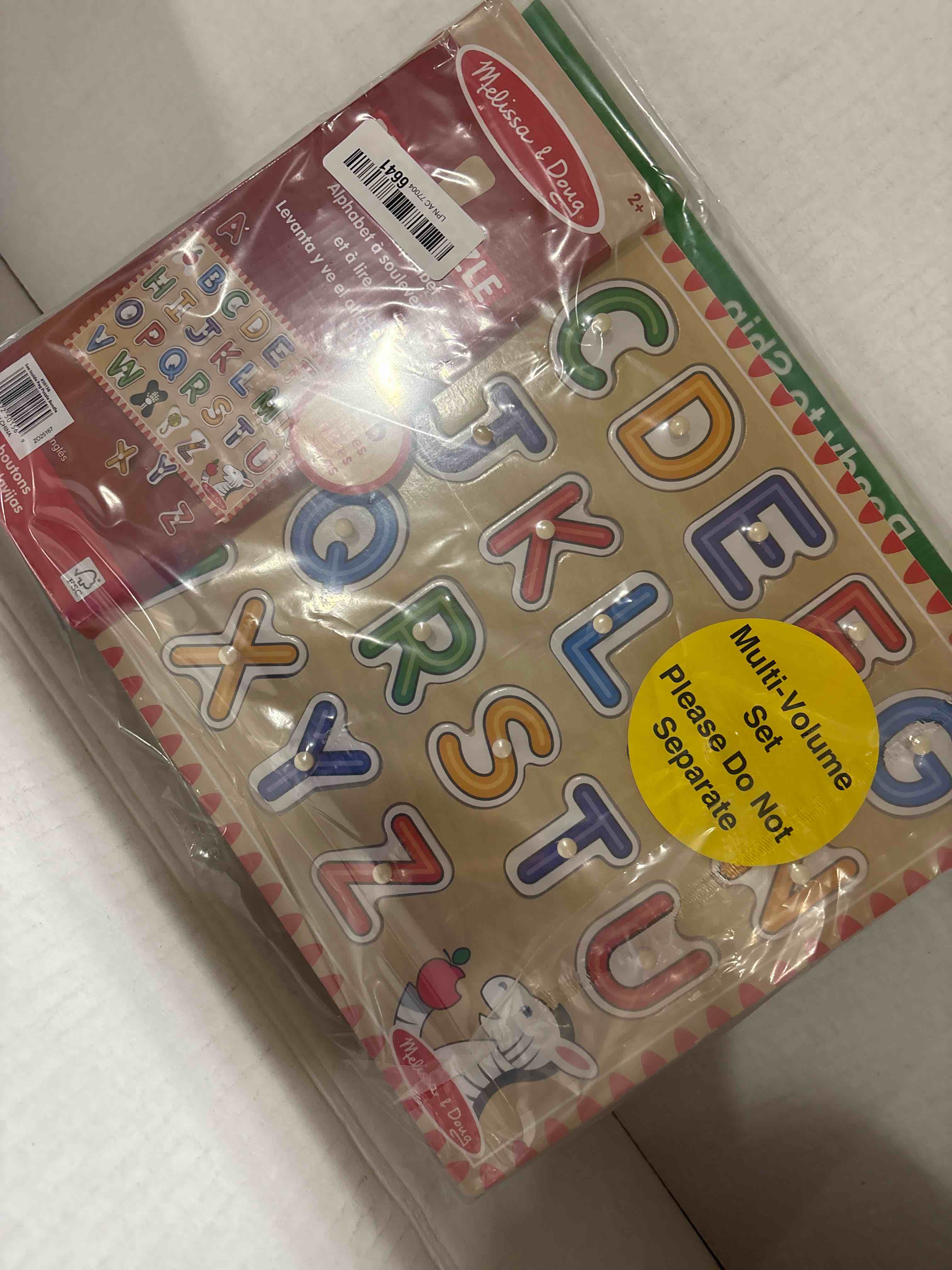 Condition photo showing New/Like New for Melissa & Doug Wooden Lift & See Peg Puzzle Early Learning 2-Pack for Girls and Boys – Alphabet, Numbers