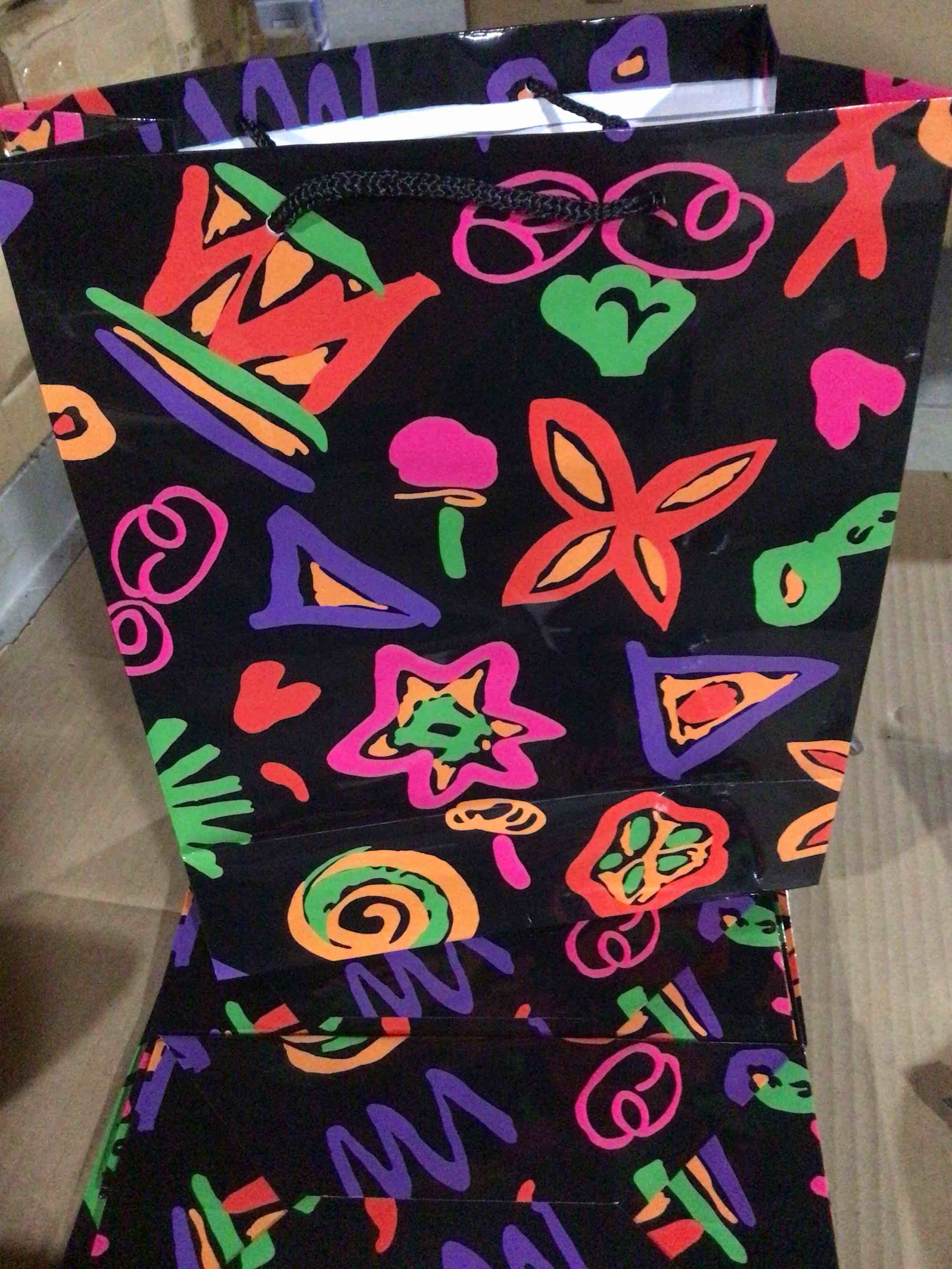 Gift features an abstract design with shapes of flourescent colors 