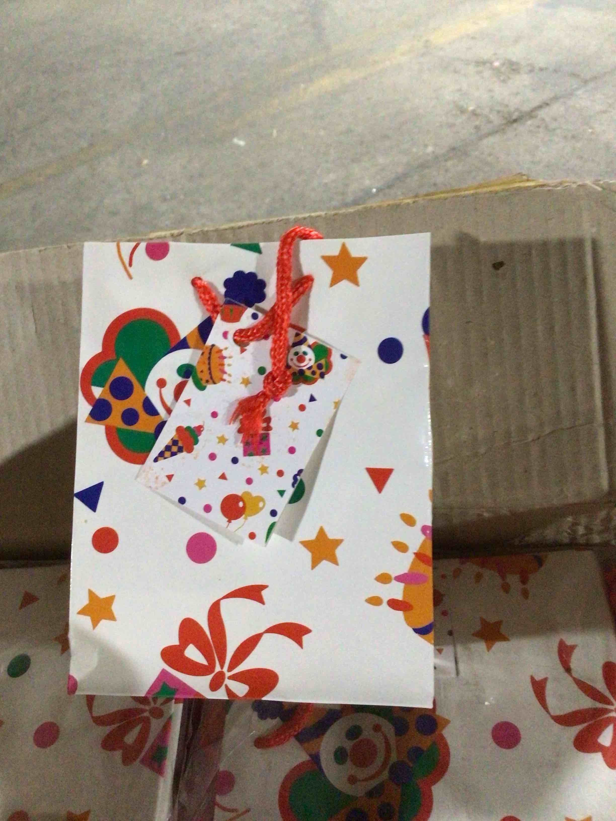 Gift bag with a clown or circus themed design 