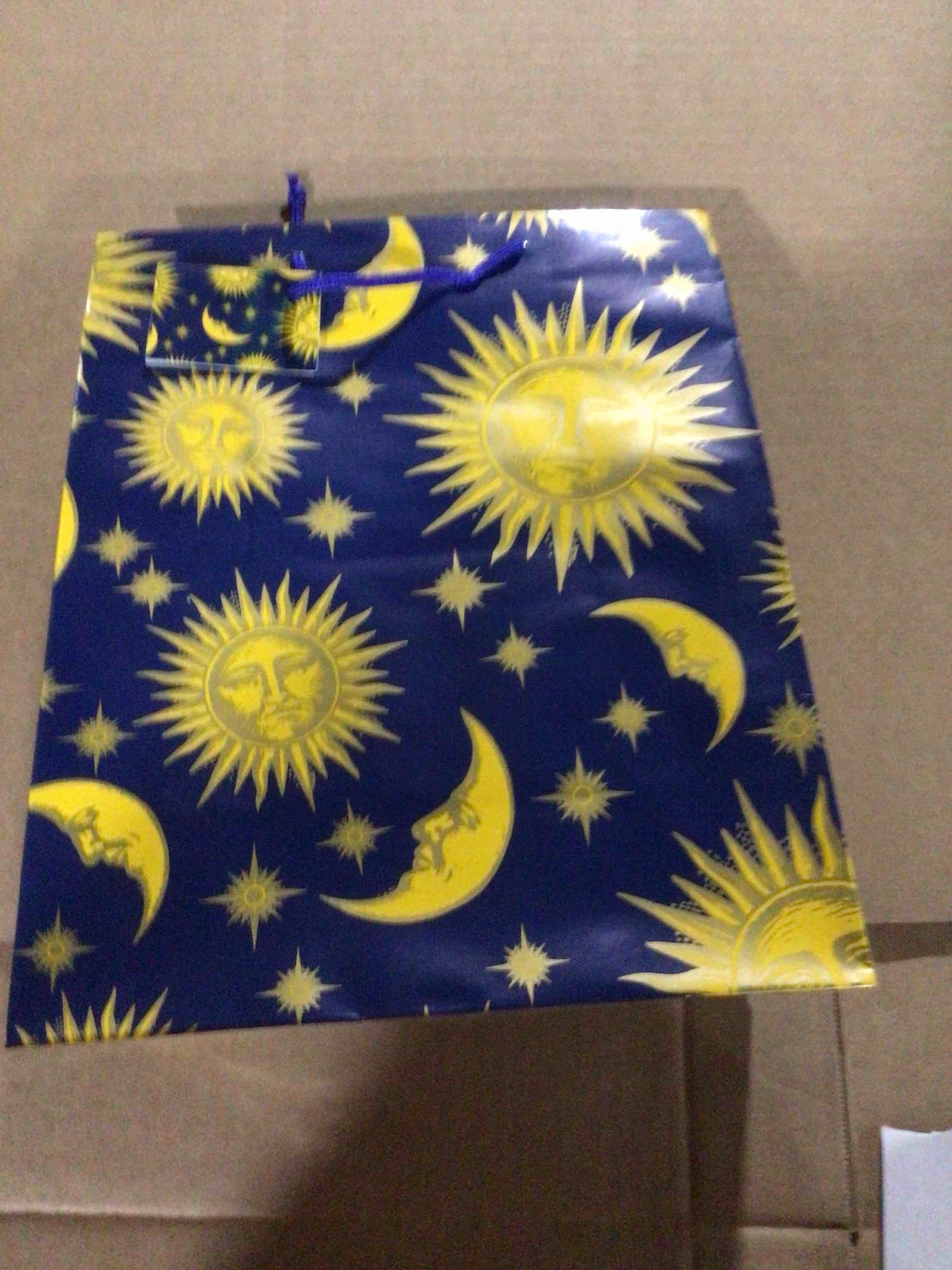 Gift bag with a popular design of sun , moon and stars , also known as celestial pattern
