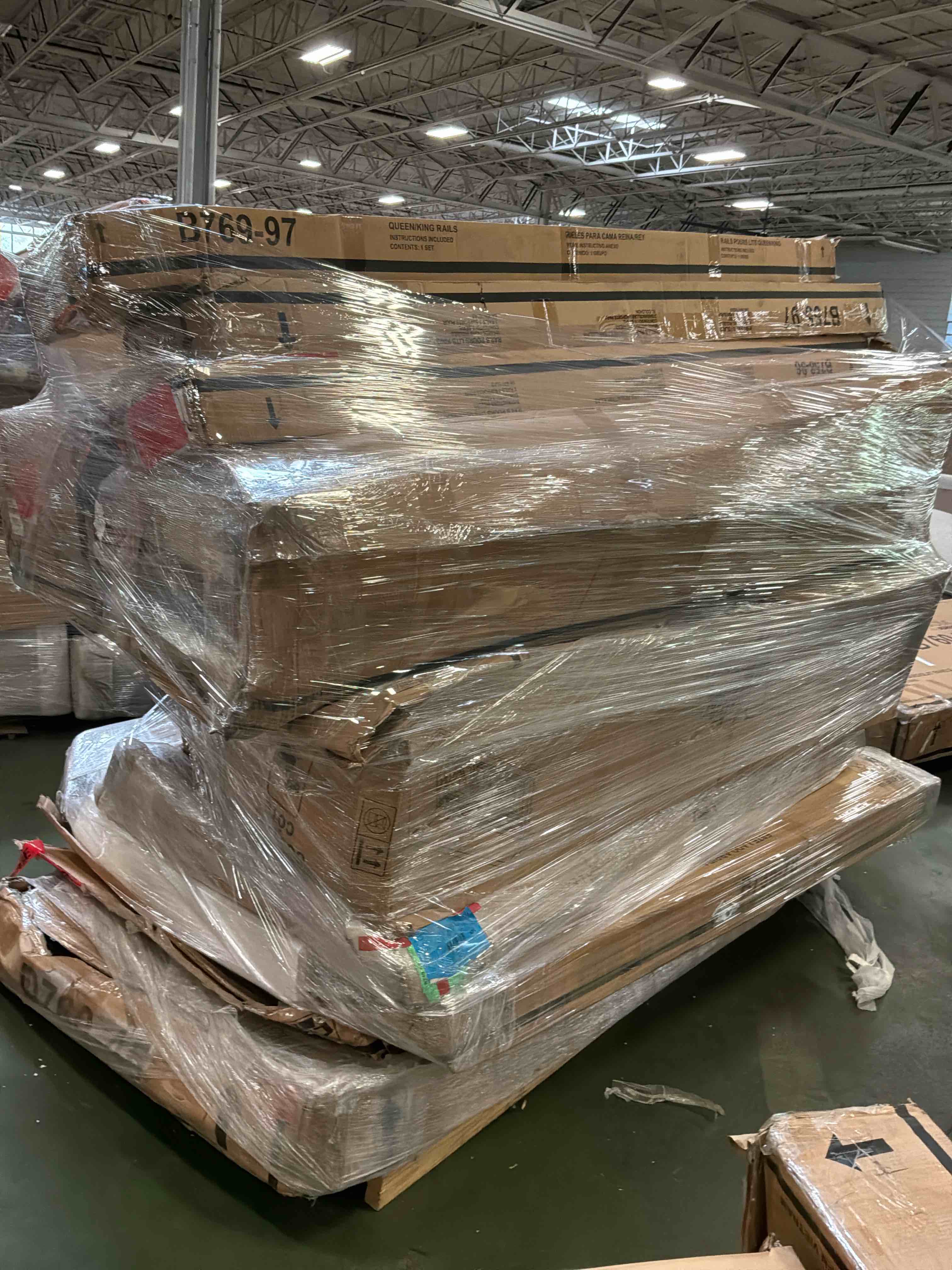 Condition photo showing As Is for pallet lot furniture ( bed parts rails and sides, headboard)