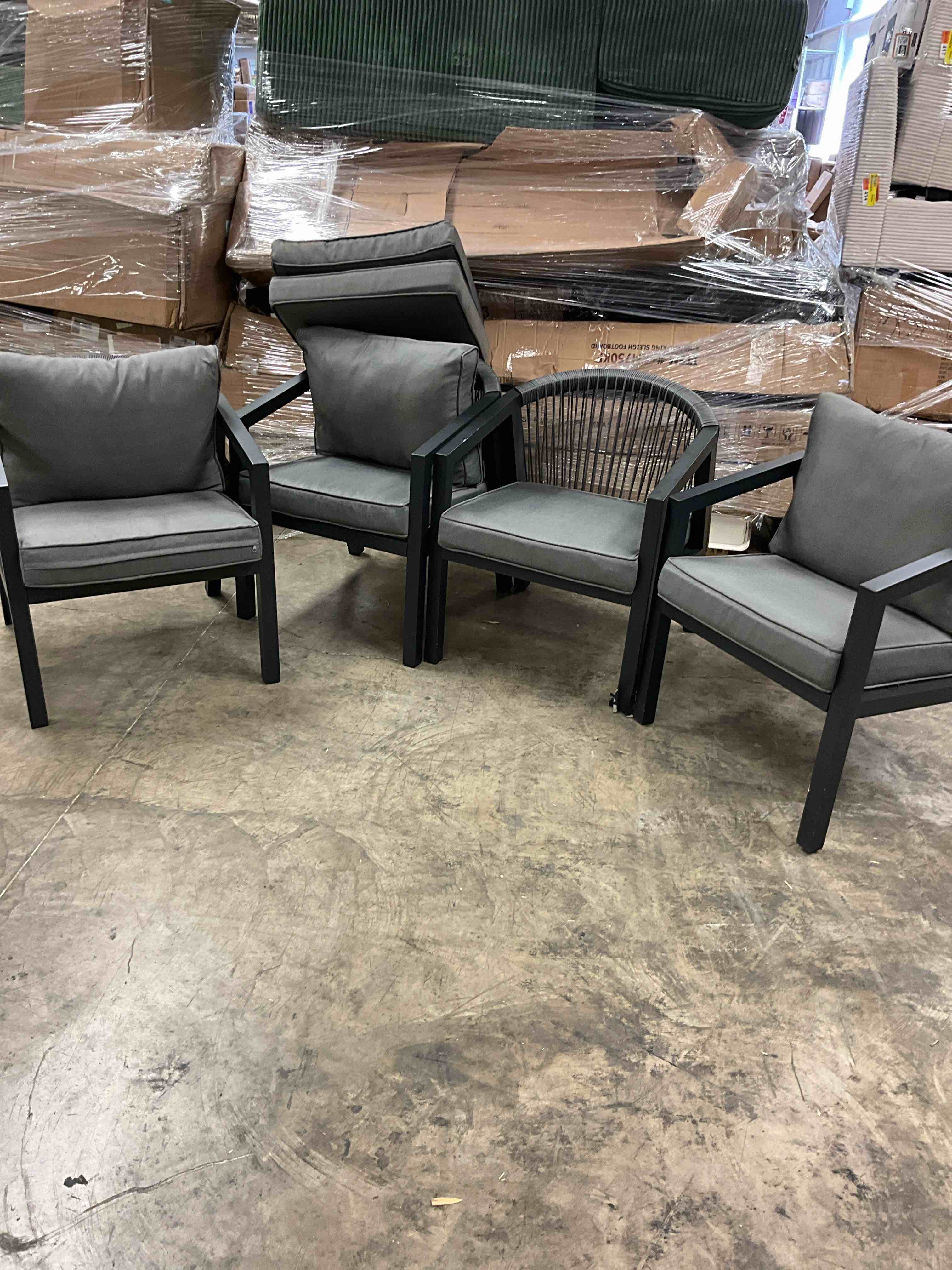 Condition photo showing Good Condition for modern black aluminum outdoor chair with gray cushions(set of 4) (missing one back cushion and one leg damage)