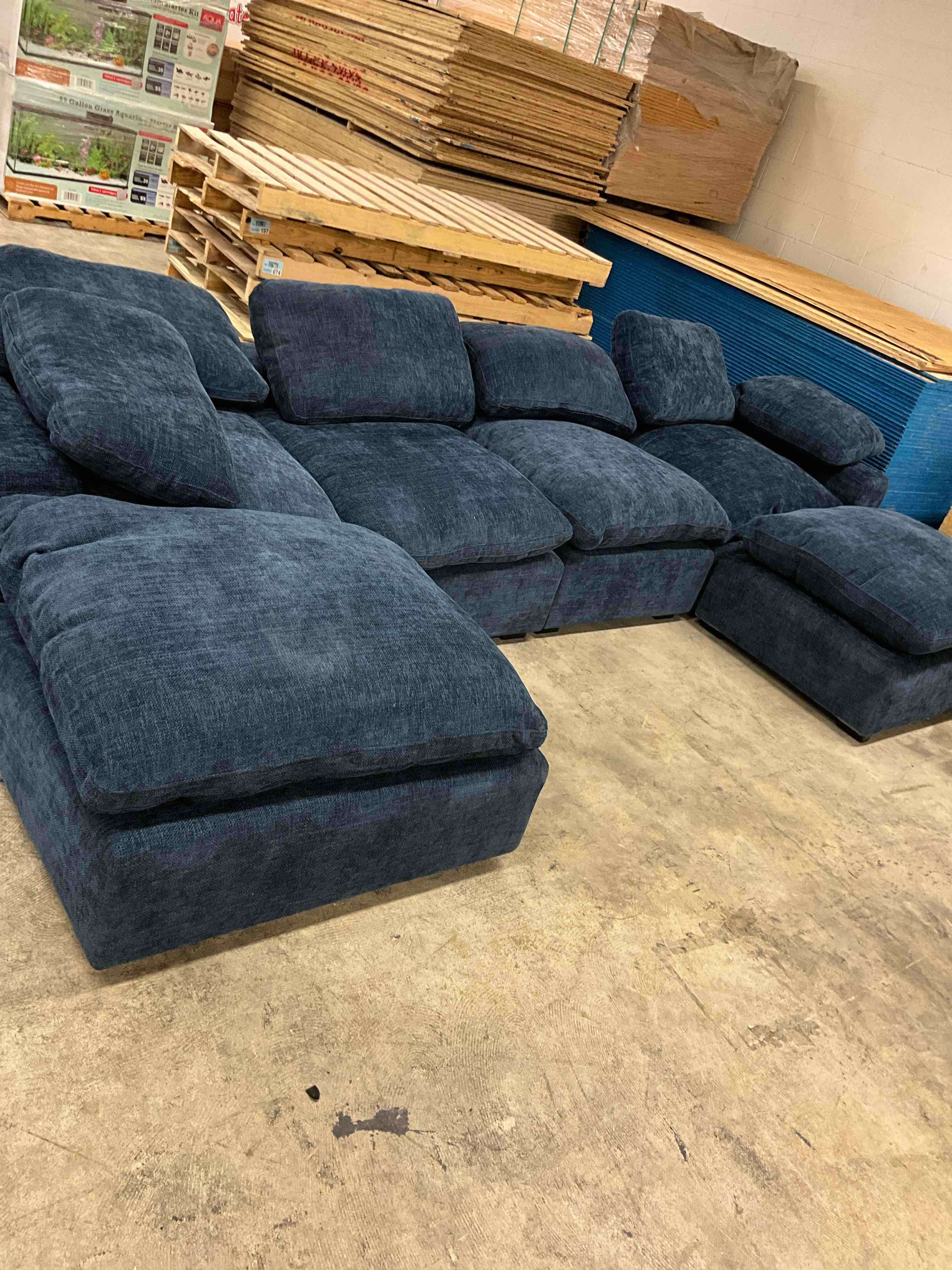 Condition photo showing Good Condition for 4 seater u-shaped sofa, chenille in navy blue (missing 2 decorative pillows)