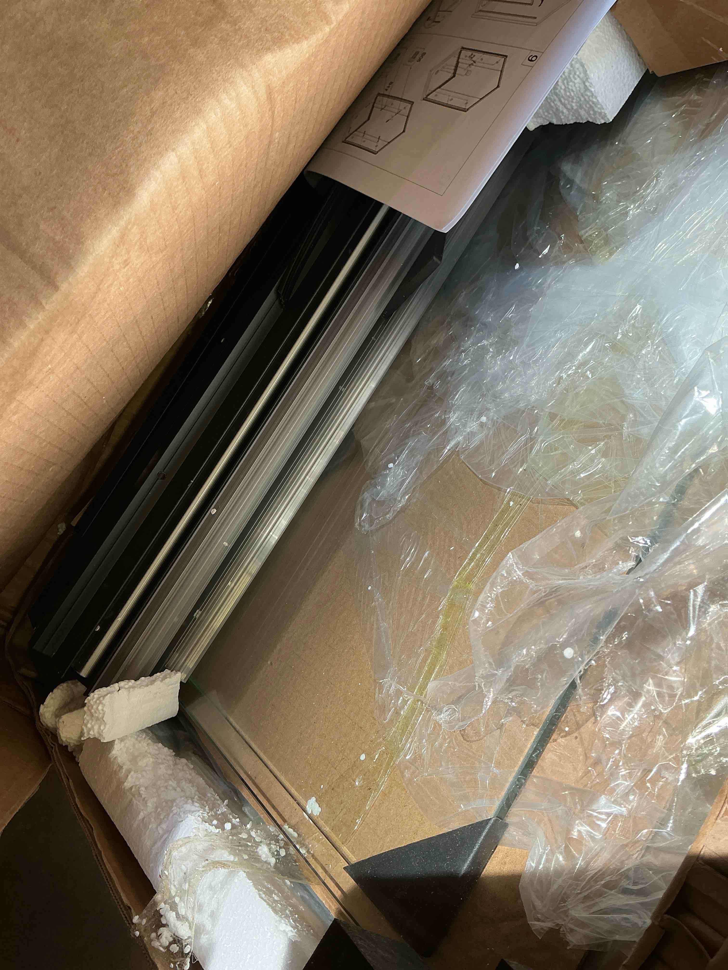 Condition photo showing As Is for sunny shower corner square shower enclosure with 1/4 in. clear tempered glass double sliding shower doors, black finish