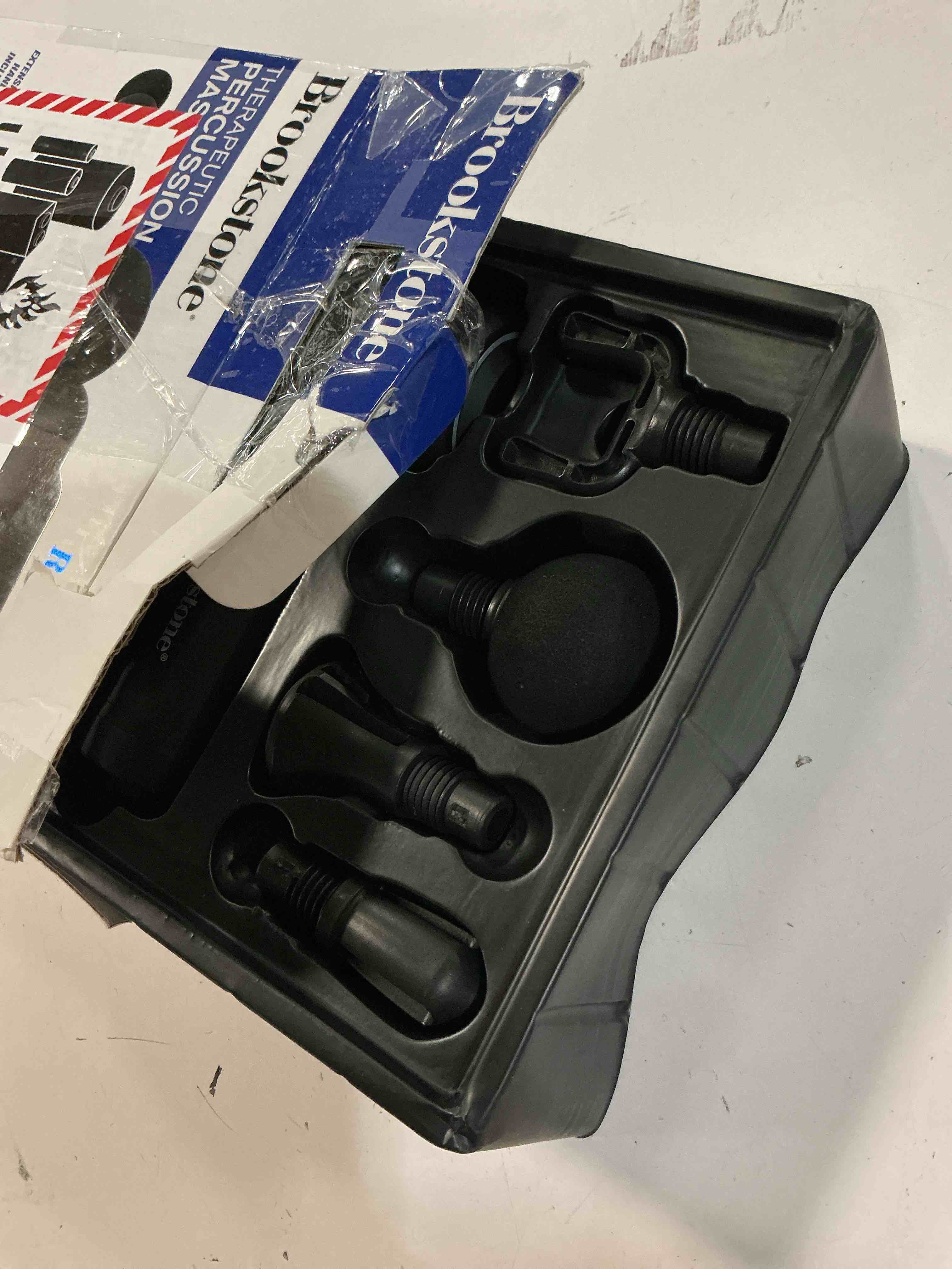 Condition photo showing As Is for brookstone deep tissue massage gun, 9-speed handheld percussion massager, 4 interchangeable heads, type-c rechargeable, quiet motor, shockproof handle