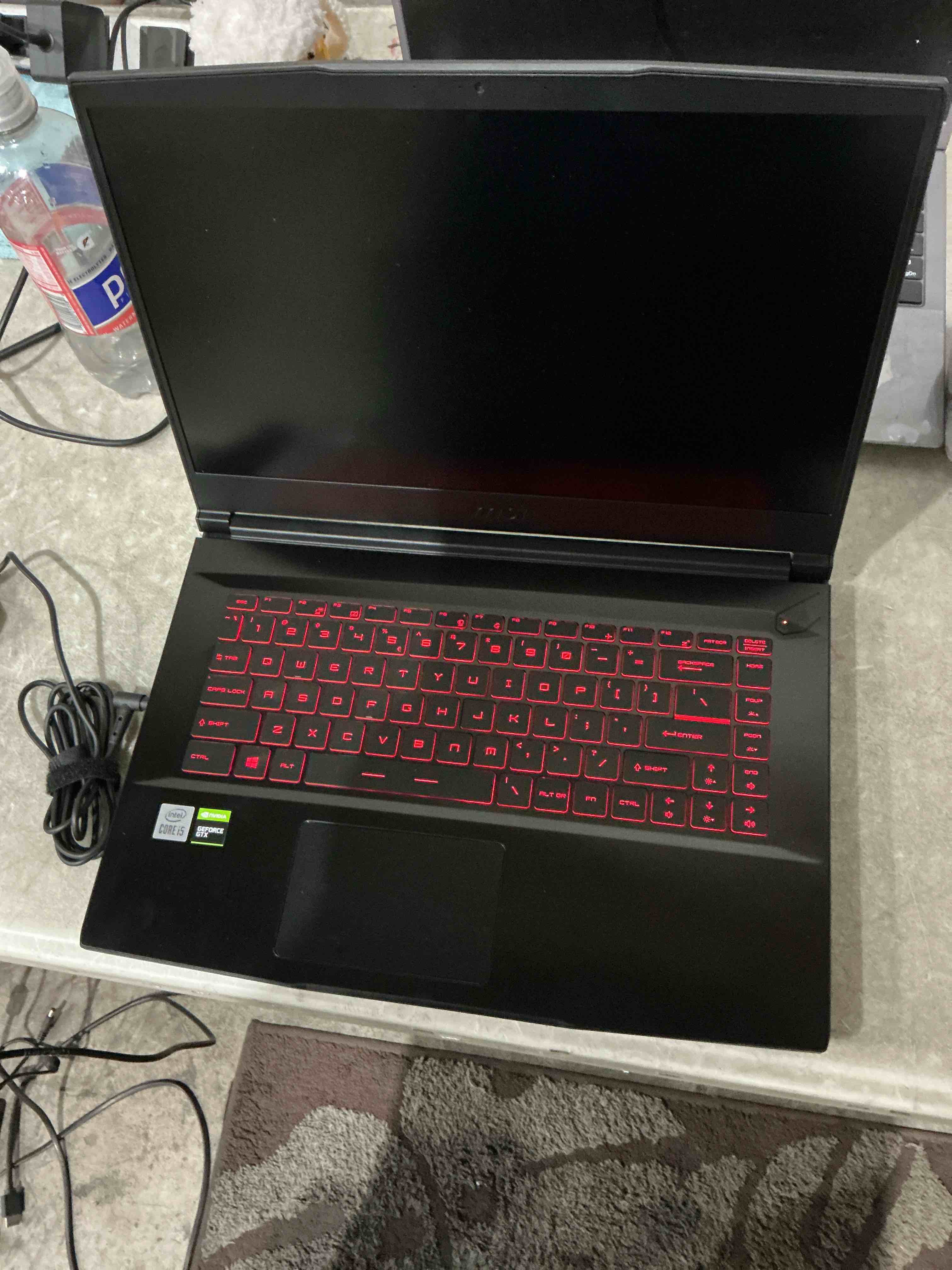 Condition photo showing As Is for screen will not power on and laptop wont stay on without charger as is!!! msi gf63 thin gtx 1650 maxq 16gb ddr4 1tb