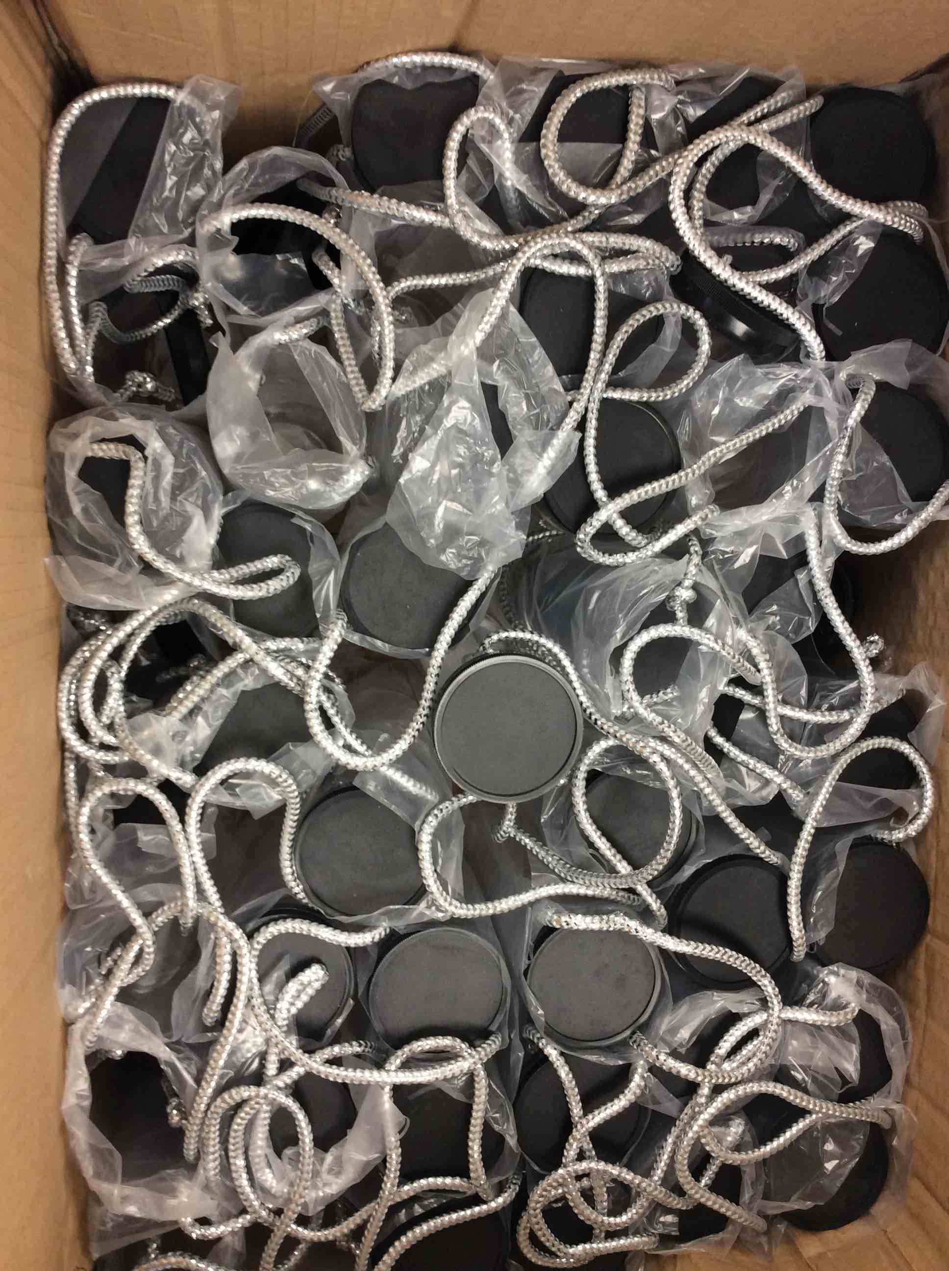 Condition photo showing New/Like New for box of clear plastic packaging tube with black lid and silver rope handle 
