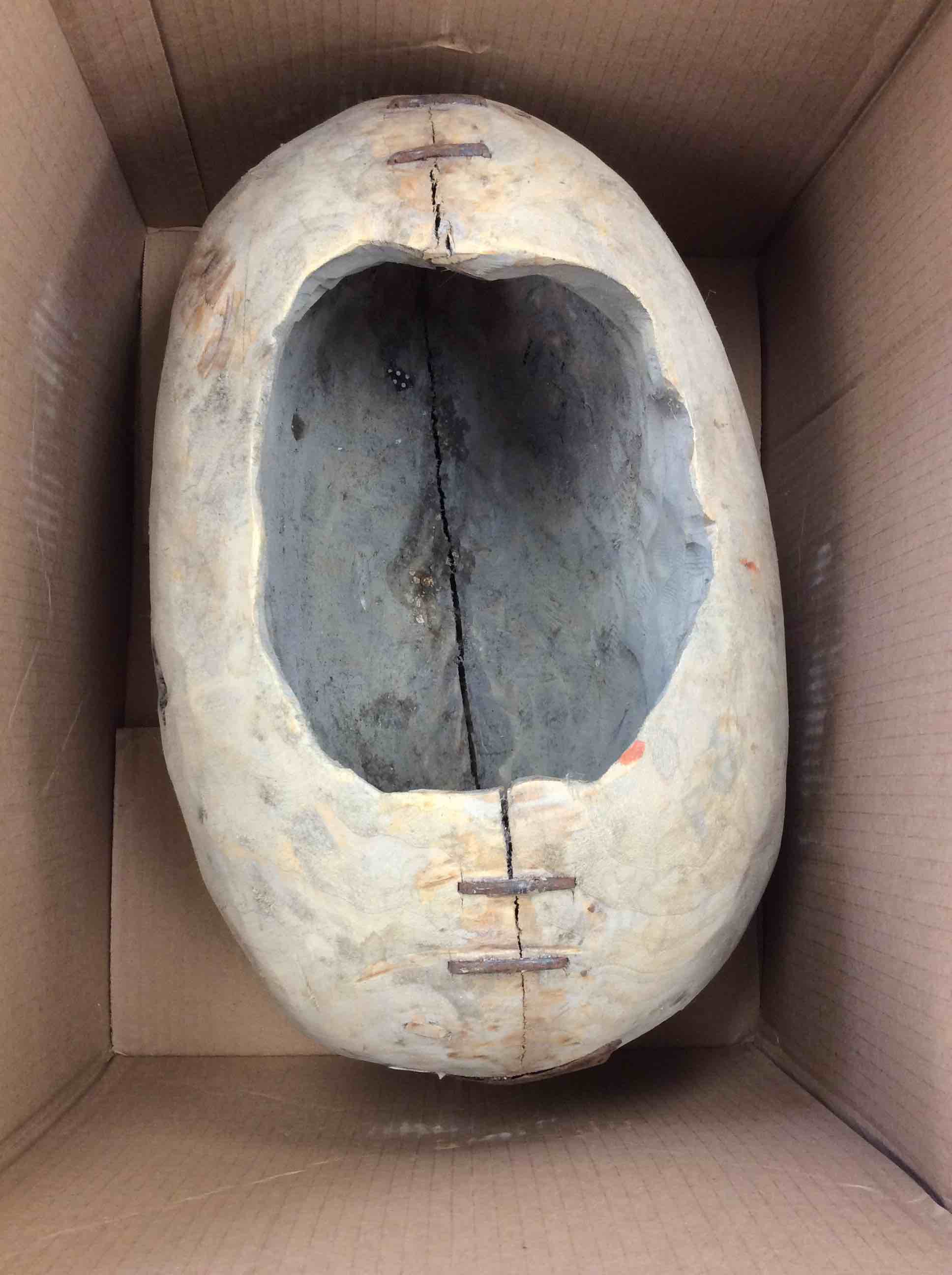 Condition photo showing Good Condition for gray hollow, egg shaped stone planter 