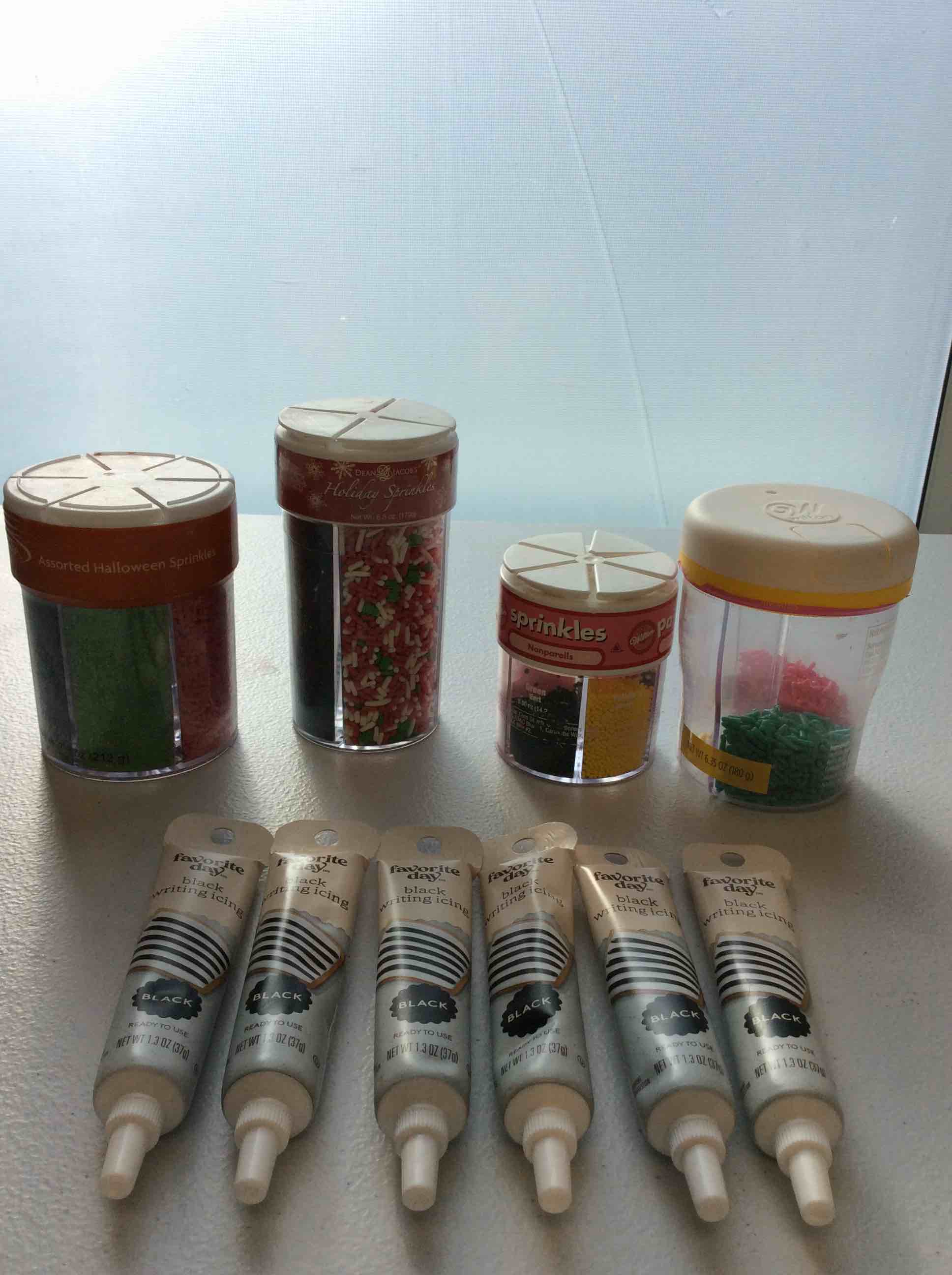 Assorted Baking Items 4 Bottles of Multicolor Sprinkles and 6 Favorite Day Black Writing Icing