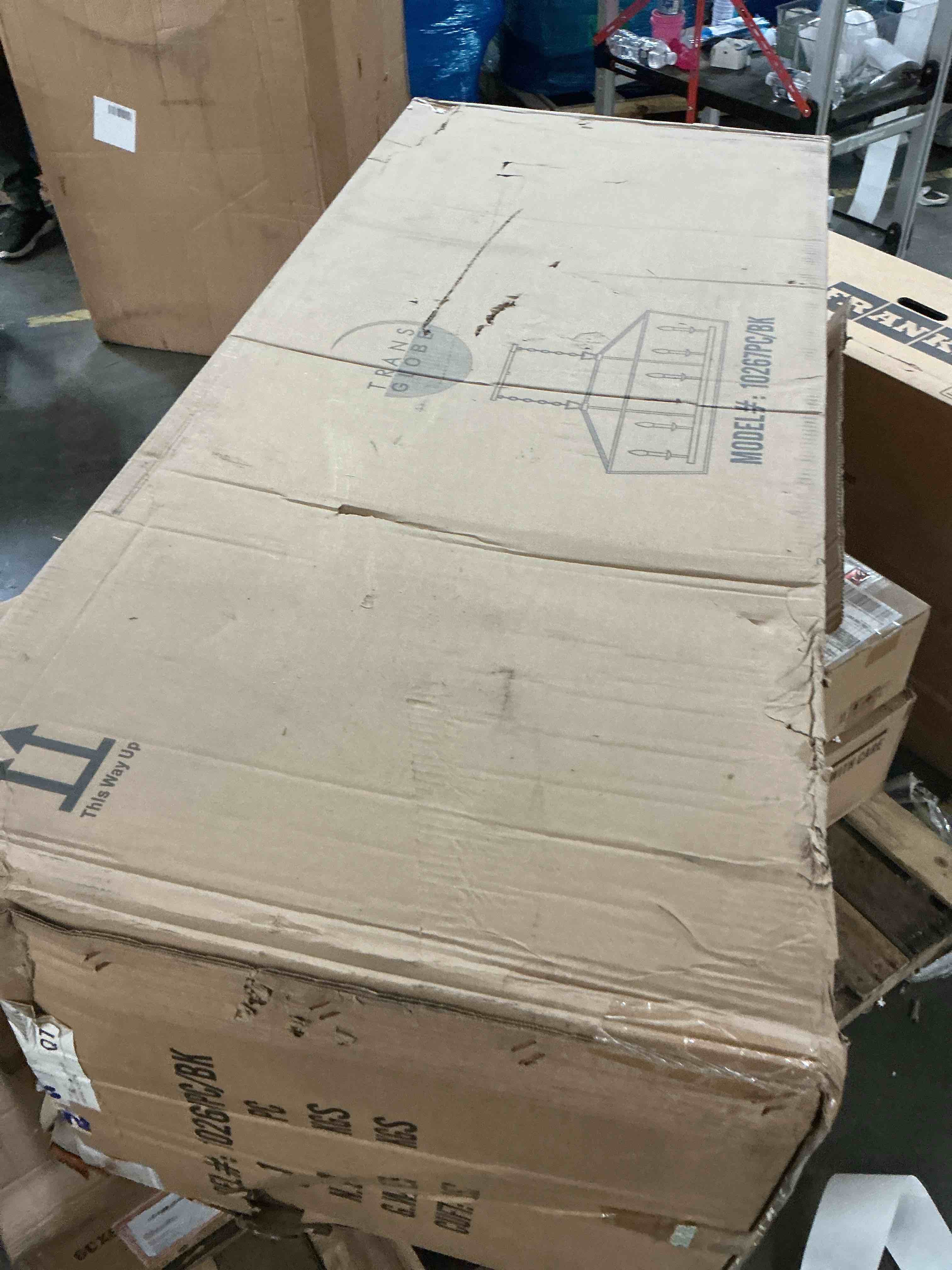 Condition photo showing Good Condition for trans globe lighting 10267 lacey 6 light 49  wide linear chandelier - black