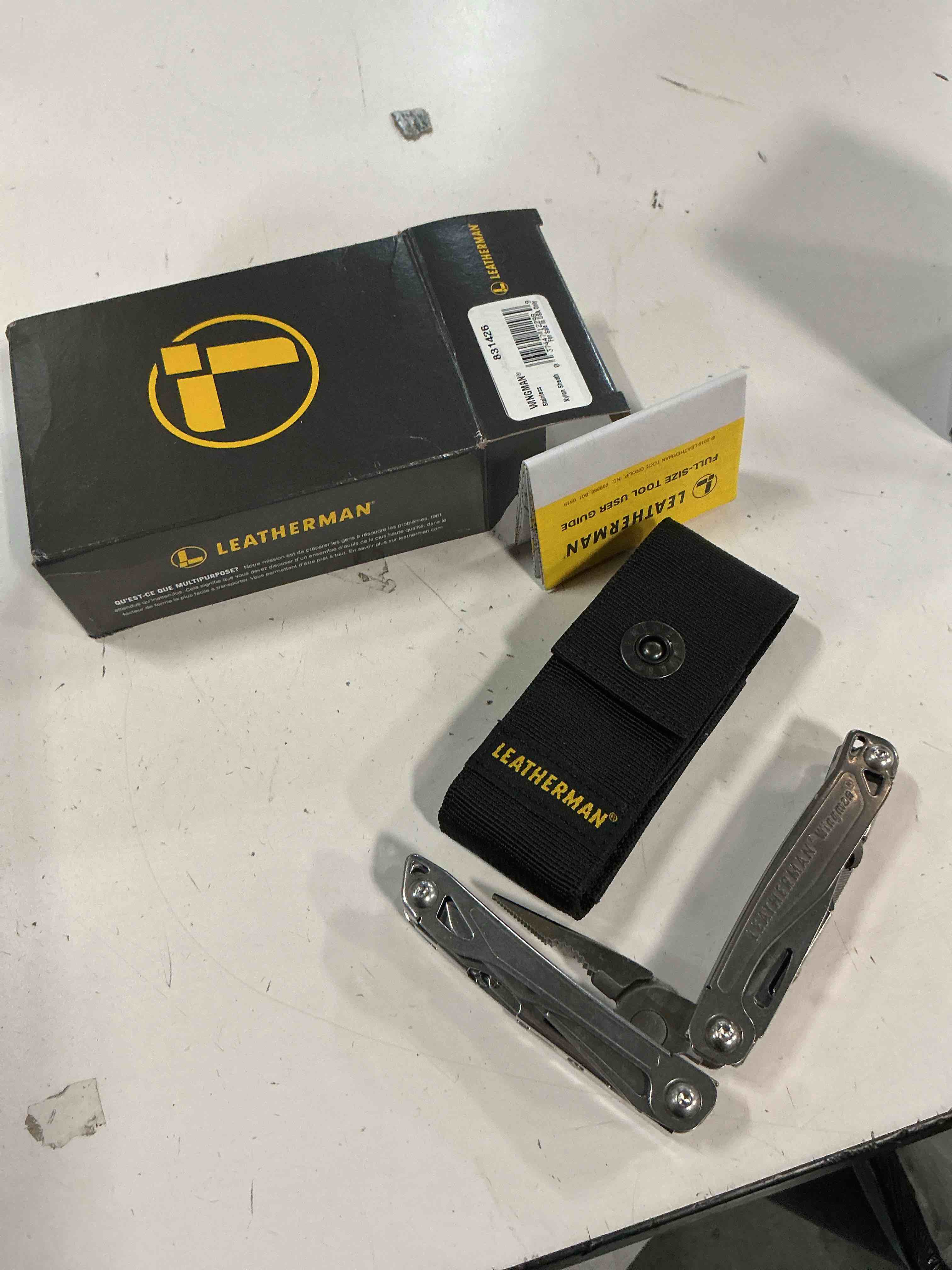 Condition photo showing New/Like New for leatherman wingman multitool with spring-action pliers and scissors stainless steel with nylon sheath