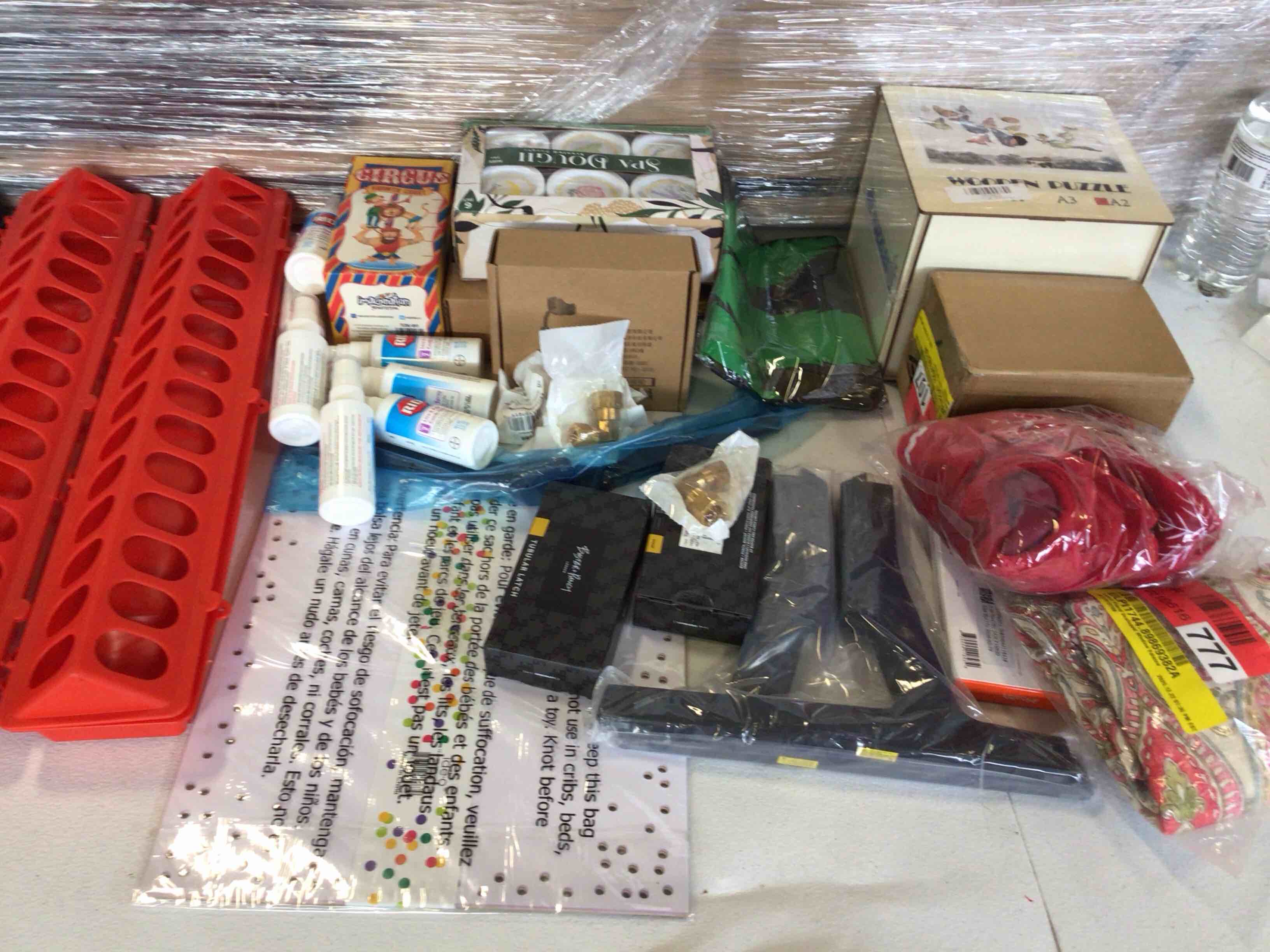 20 Count Assortment of various products, including fragrances, lens cleaning fluid, toilet seat covers, and more.
