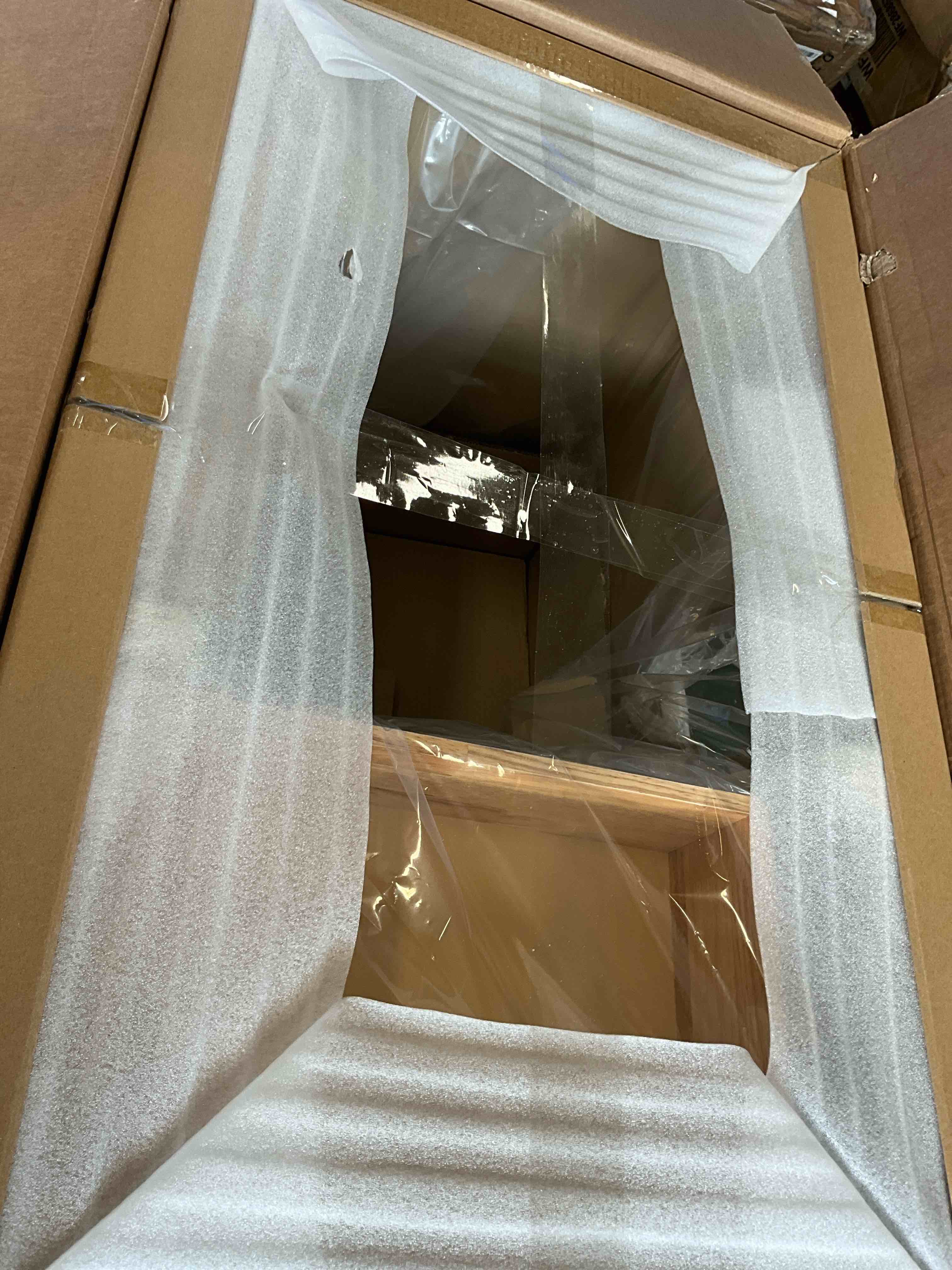 Condition photo showing Good Condition for ariel hepburn 36 inch left offset single sink base cabinet in oak (it has a hole in the back side , please see additional photos for more details)