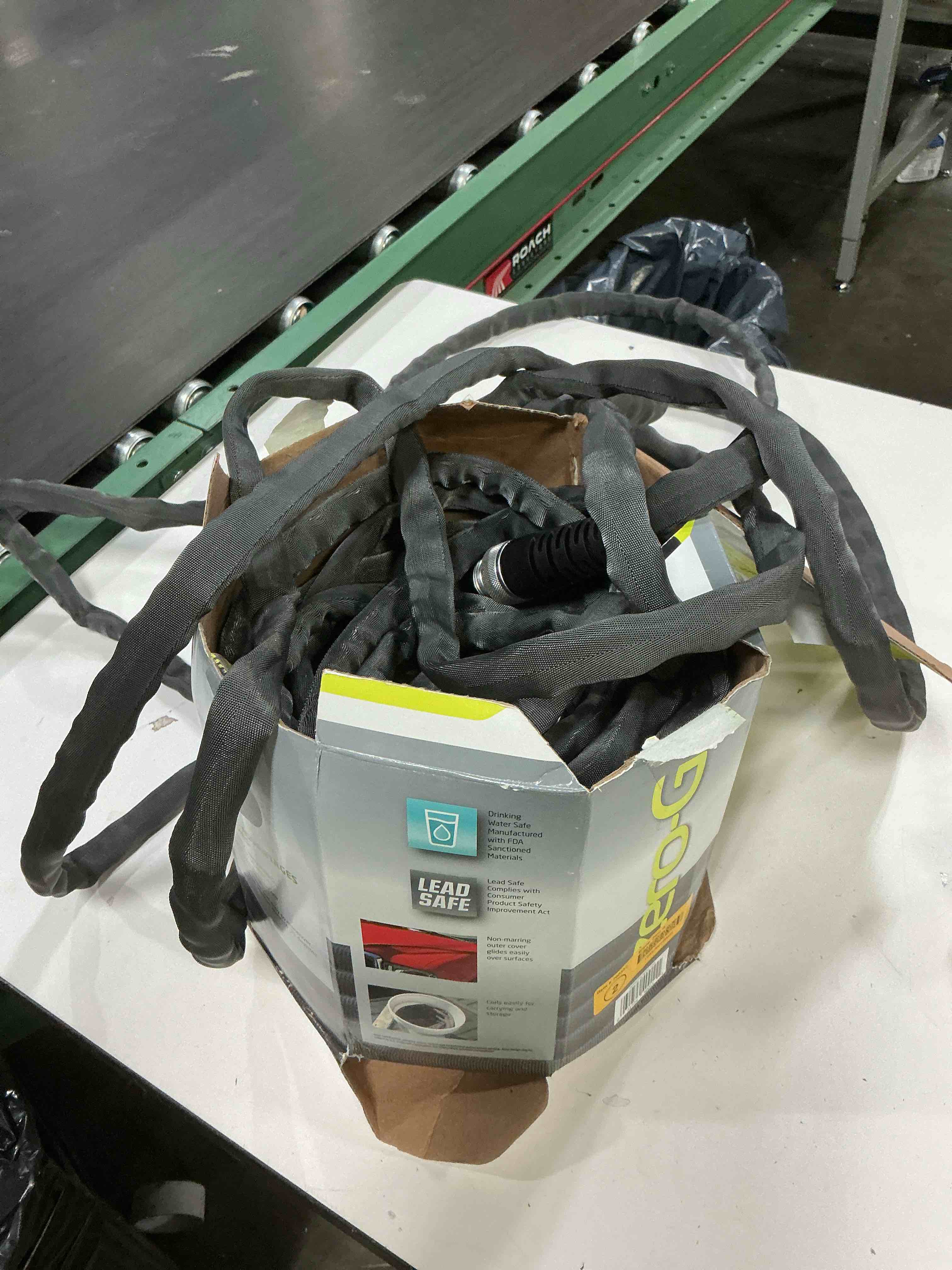 Condition photo showing As Is for zero-g 4001-100 garden hose, 5/8" x 100', gray zero-g 5/8" x 100'