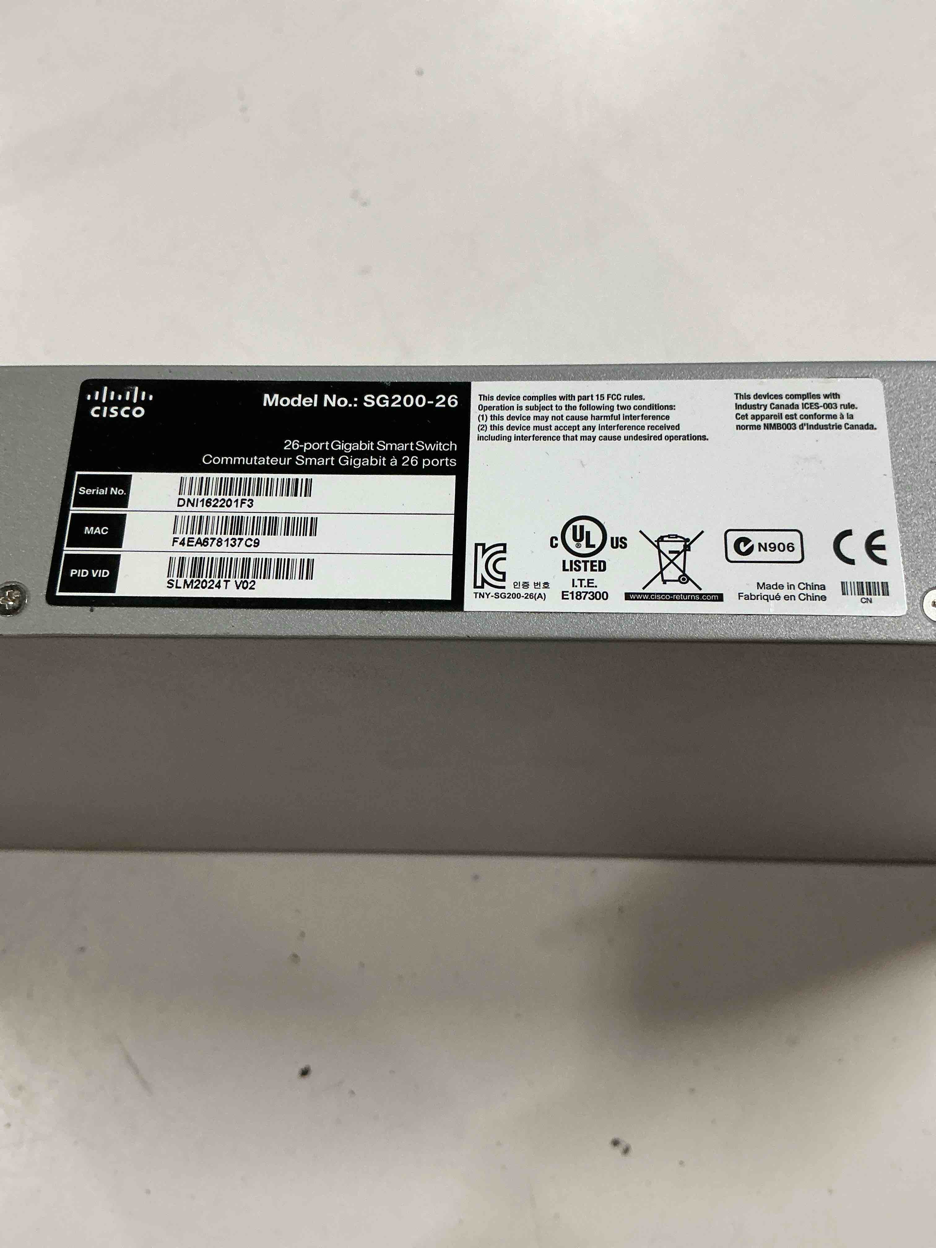Condition photo showing As Is for cisco designed sg200-26 gigabit ethernet smart switch with 24 10/100/1000 ports and 2 combo mini-gbic ports (slm2024t-na), one size