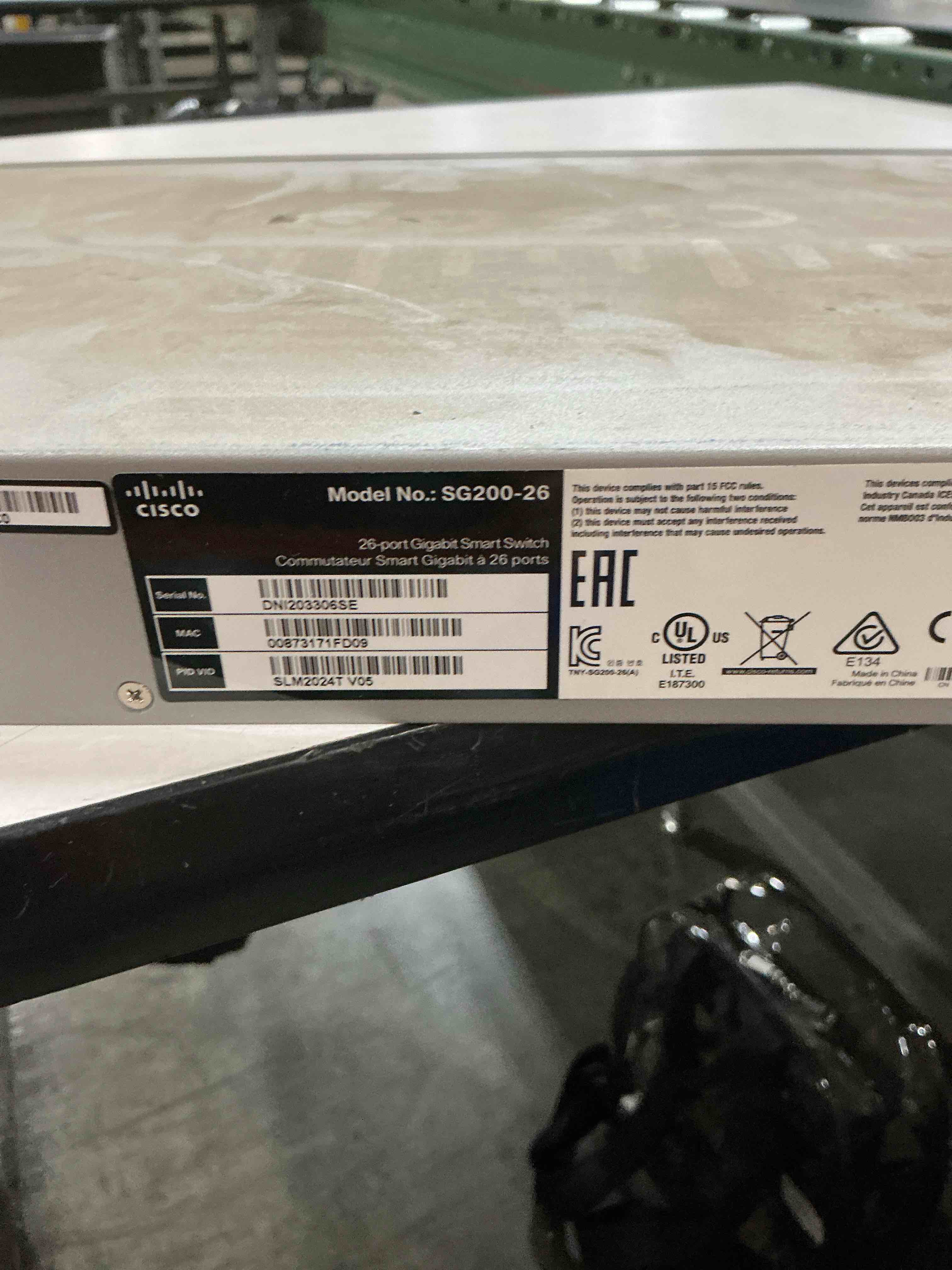 Condition photo showing As Is for cisco designed sg200-26 gigabit ethernet smart switch with 24 10/100/1000 ports and 2 combo mini-gbic ports (slm2024t-na), one size