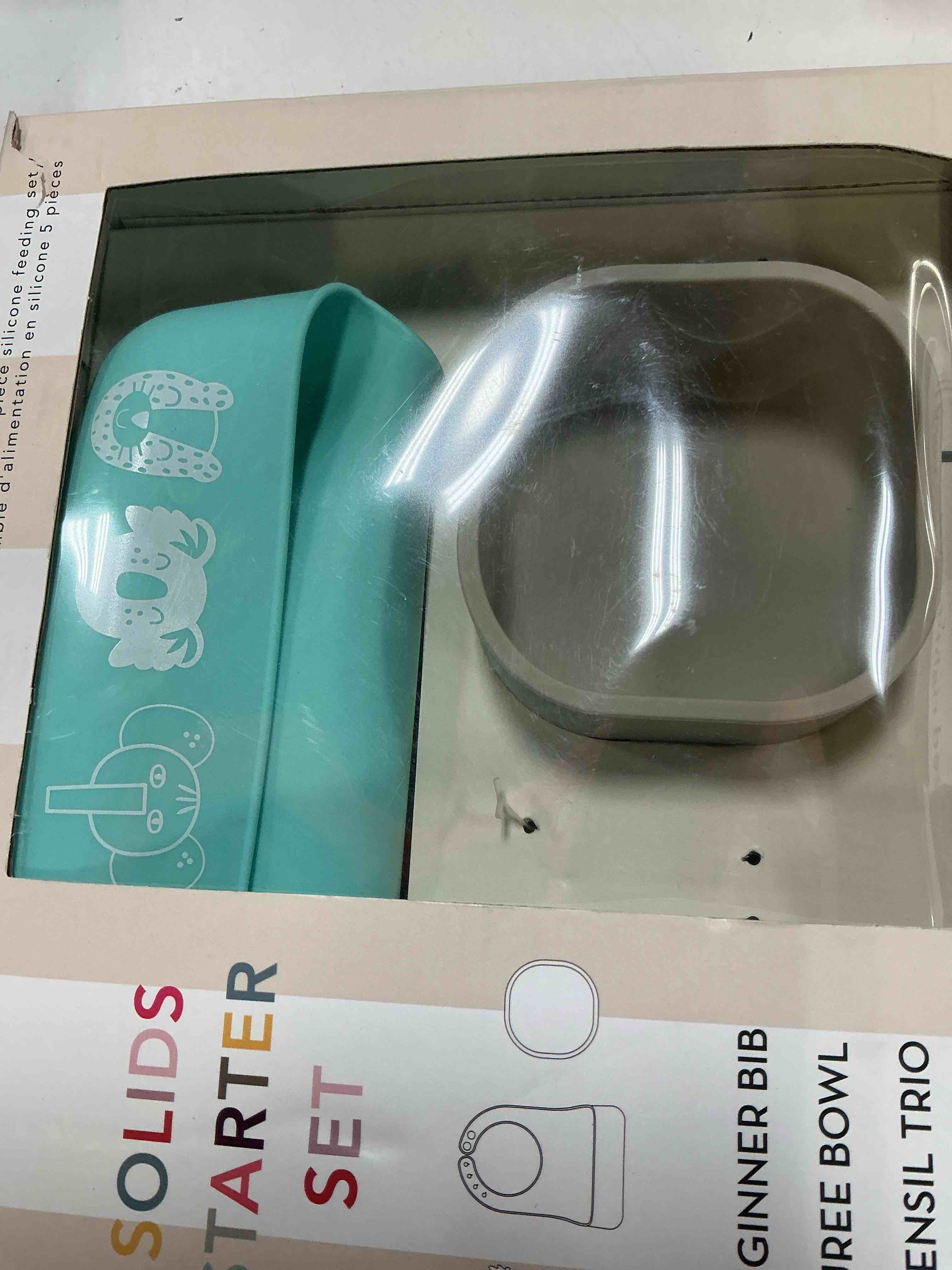 Condition photo showing As Is for (similar design,incomplete) paperclip feeding starter kit with silicone bib, suction bowl and spoon & spork set 