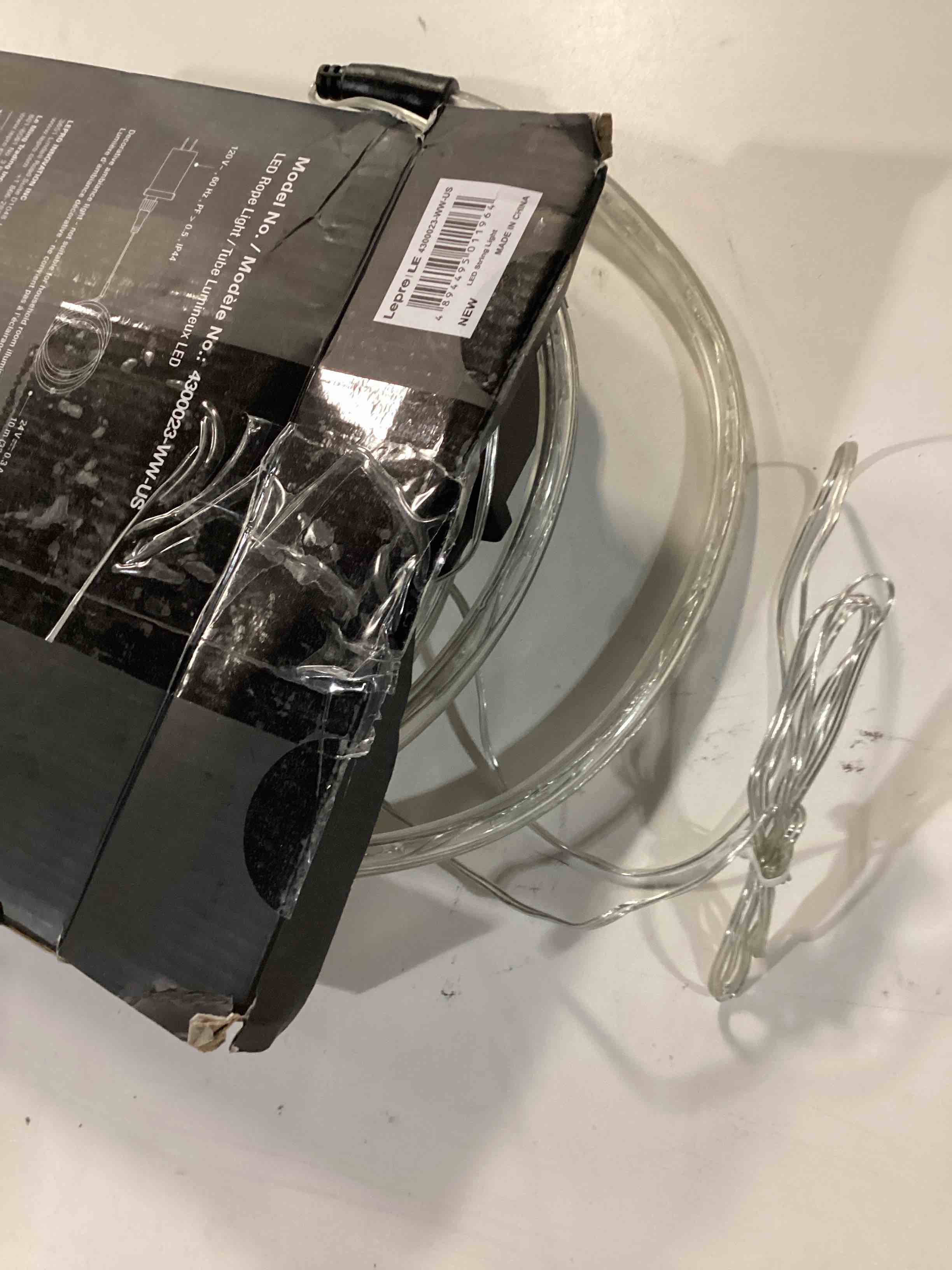 Condition photo showing As Is for le 33ft 240 led rope lights outdoor 24 volts, 3/8 inch clear tube, upgraded 2700k warm white, connectable (up to 3 sets), not dimmable, waterproof string lights for patio deck railing stair landscape